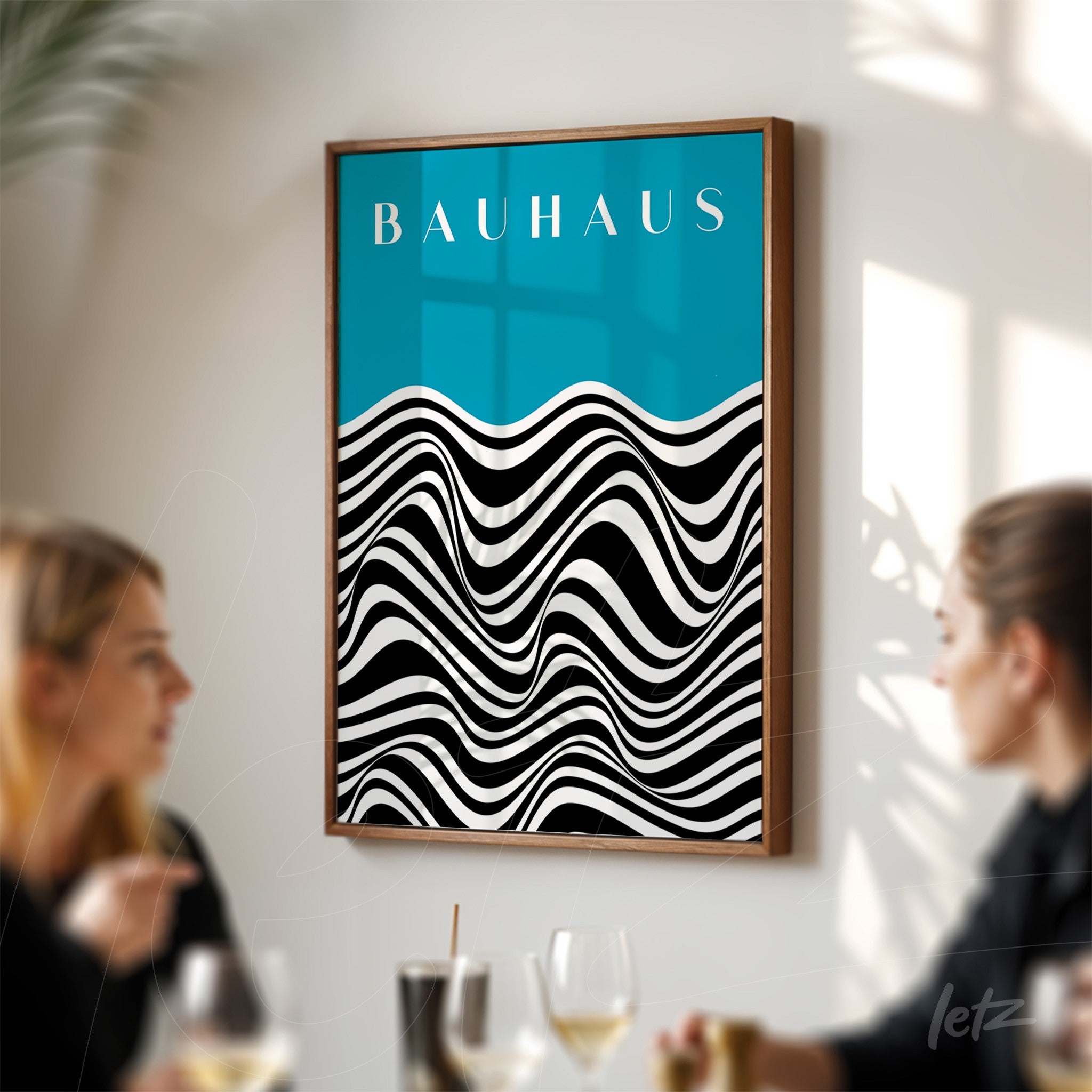 poster print featuring geometric wave design in black and white on a blue background with the word bauhaus, displayed in a wooden frame in a bright setting