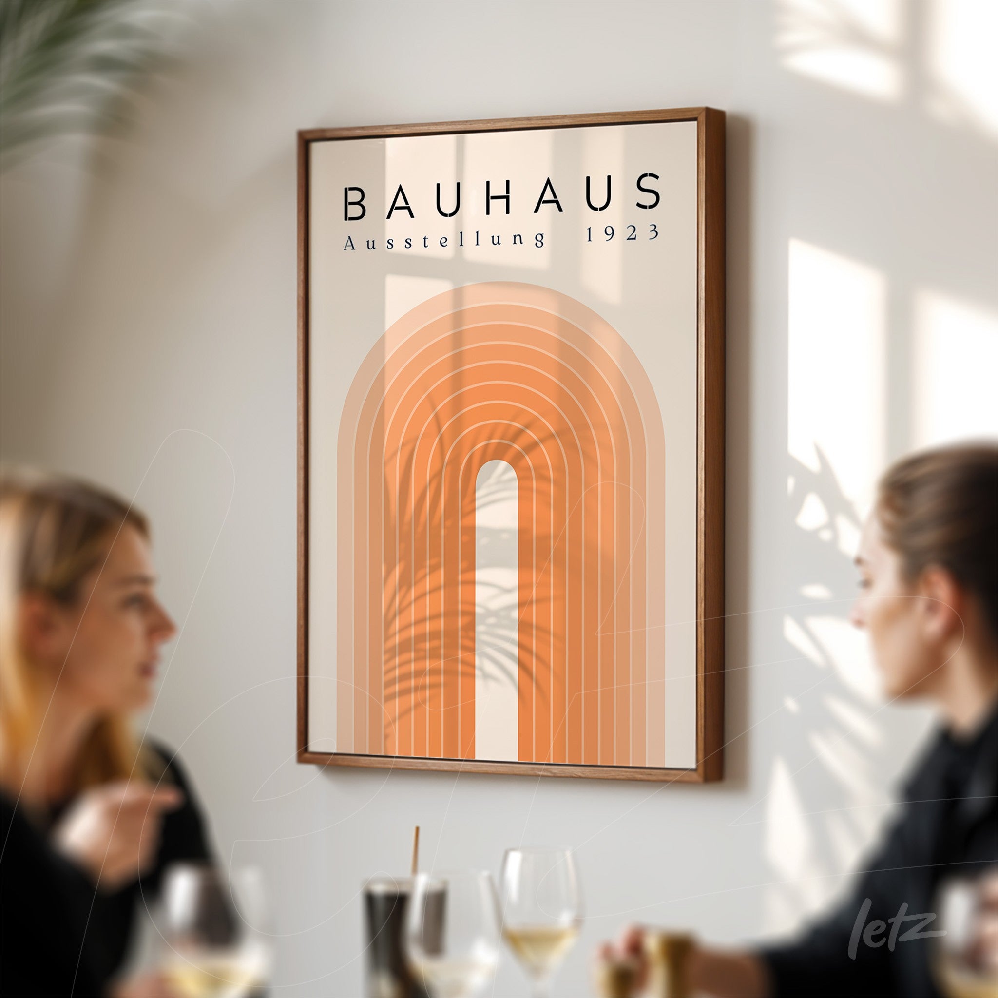 framed wall art in Bauhaus style featuring an orange geometric arch and the title 'Austellung 1923', with a dark wood frame