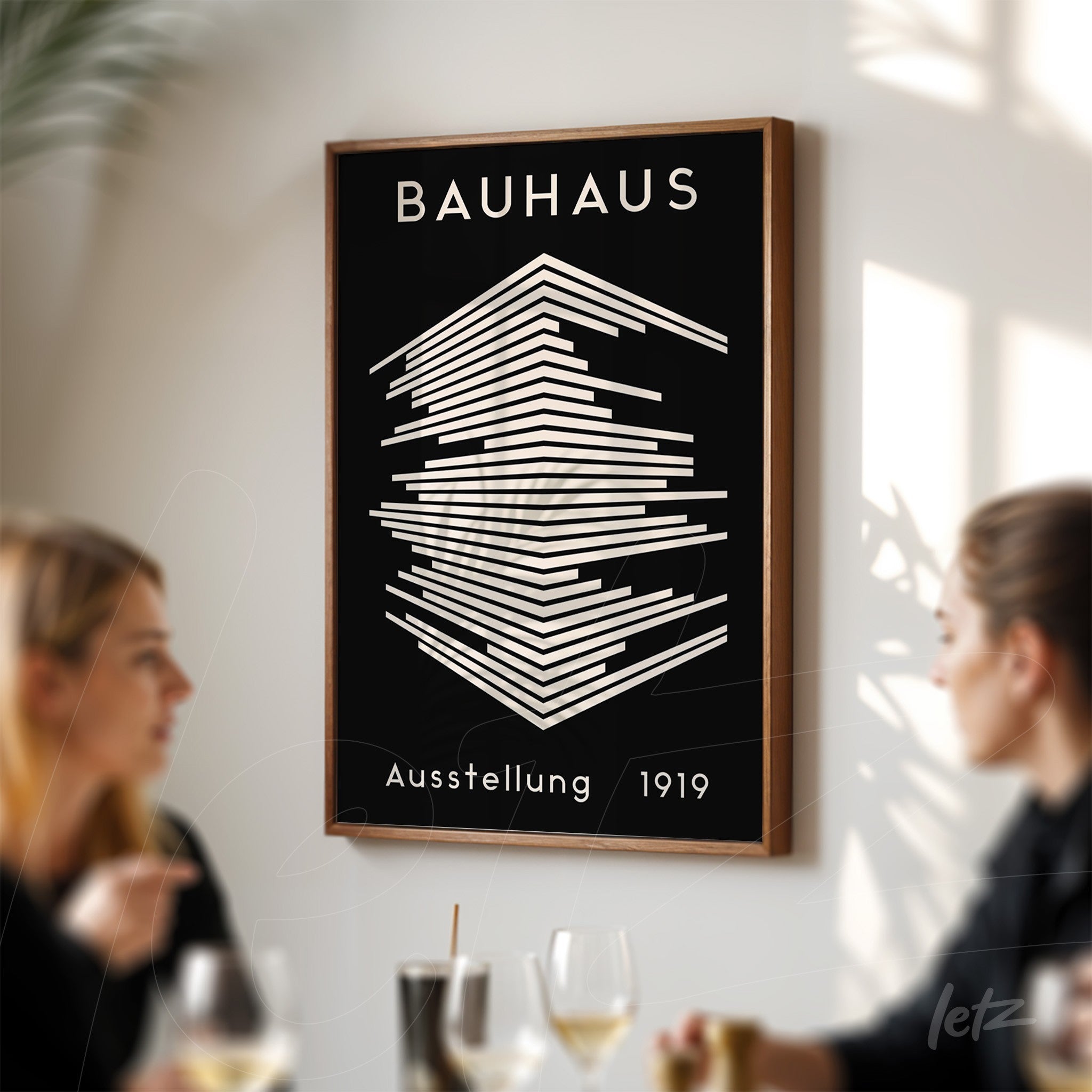 minimalist black and white bauhaus 1919 art in wooden frame displayed on white wall