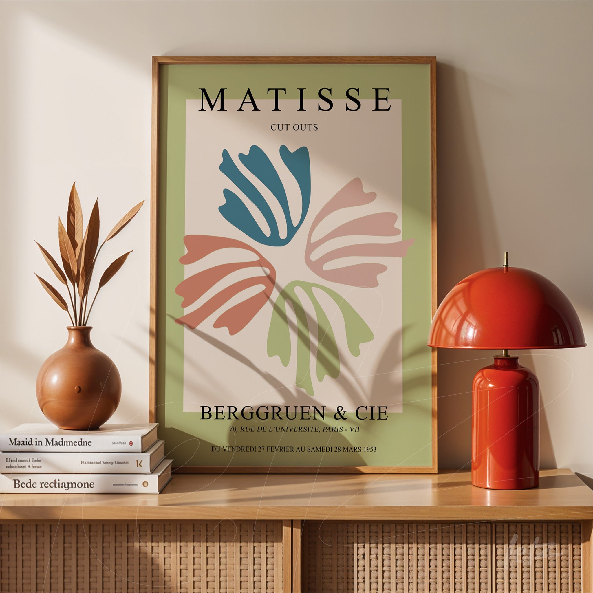 decorative wall art featuring a Matisse cut-out design in light wood frame, showcasing colorful organic shapes on a soft green background above a wooden sideboard