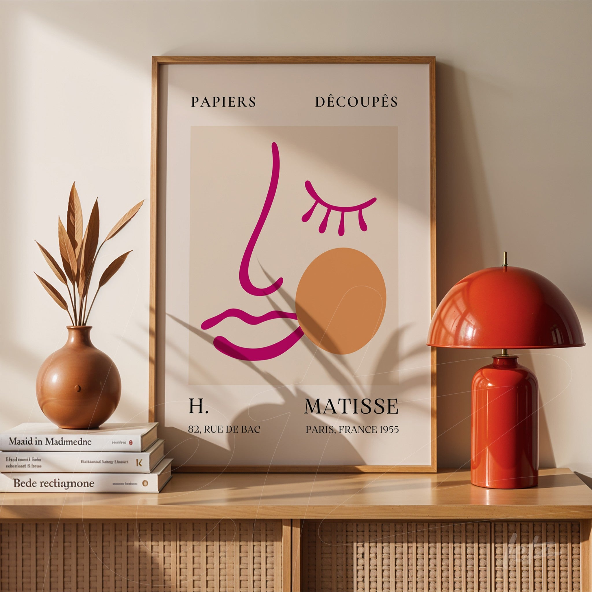 decorative wall art featuring abstract line art on a neutral background, showcasing geometric shapes and a stylized face with a classic wooden frame