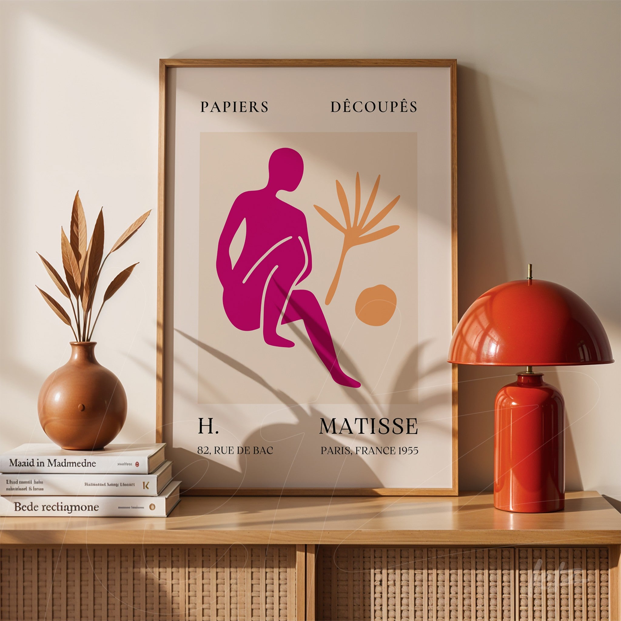 decorative framed art by Henri Matisse featuring stylized shapes in pink and yellow with a light wood frame