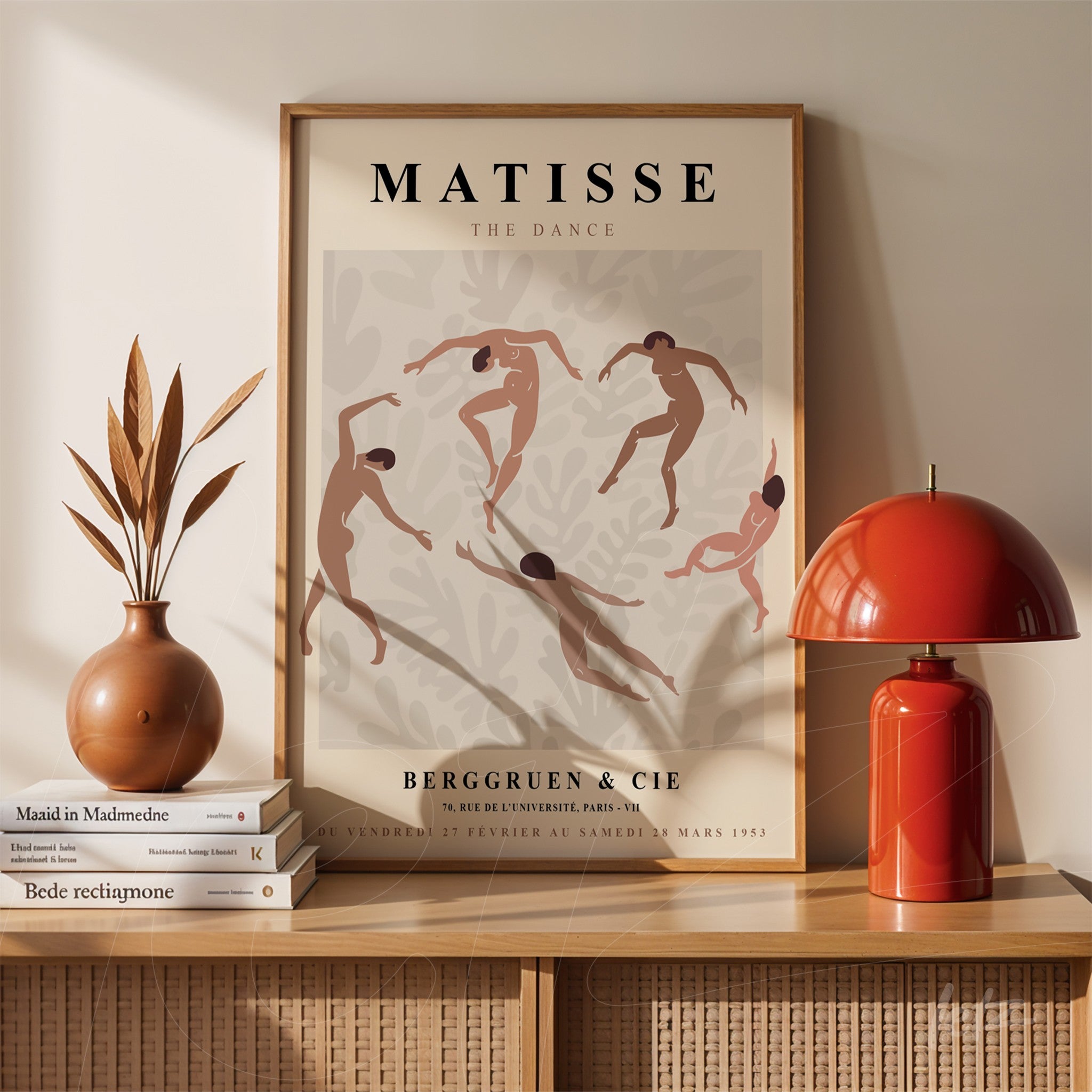 framed art piece of Matisse's 'The Dance' featuring dancing figures in shades of pink and beige with a light wooden frame