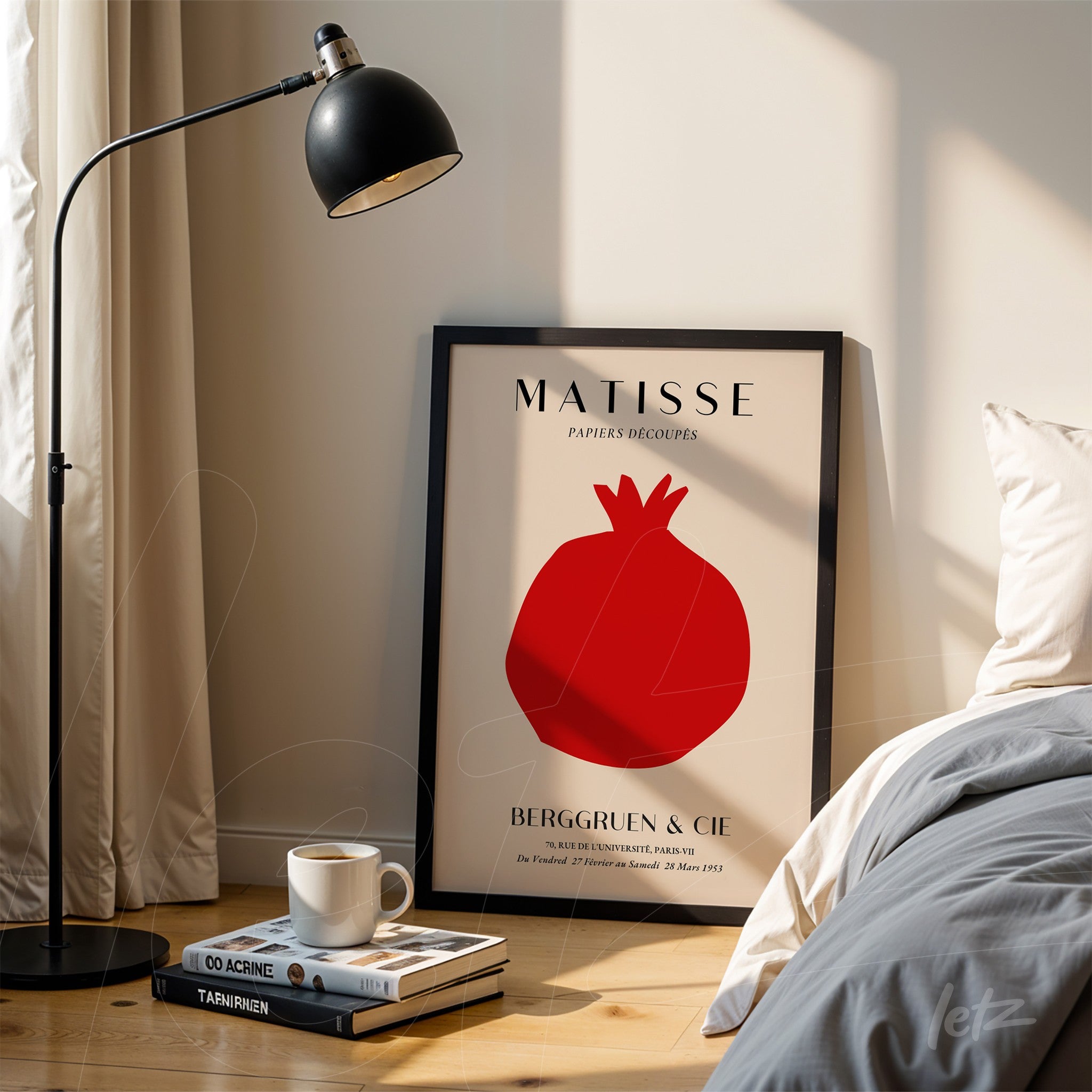 decorative wall art featuring abstract pomegranate in black frame displayed next to a lamp in a well-lit setting