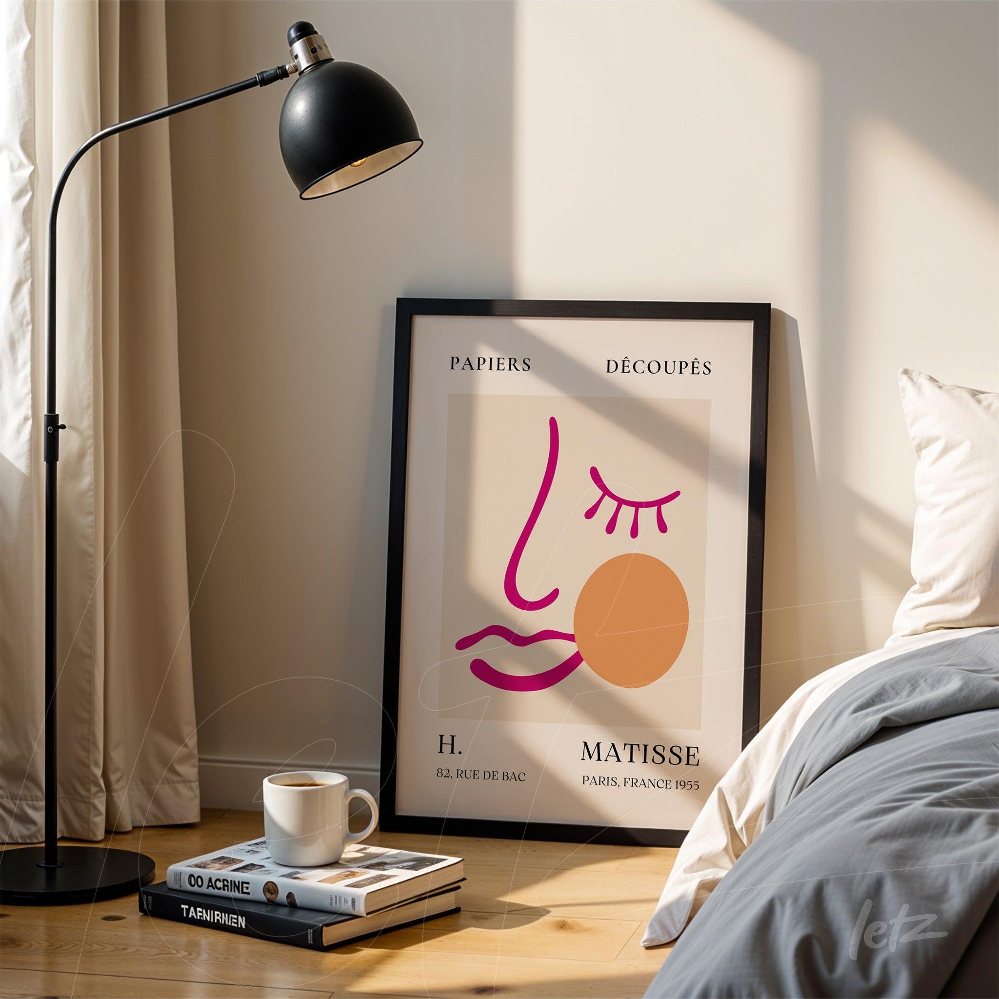 decorative wall art featuring modern illustration of a feminine face in black frame displayed next to a lamp
