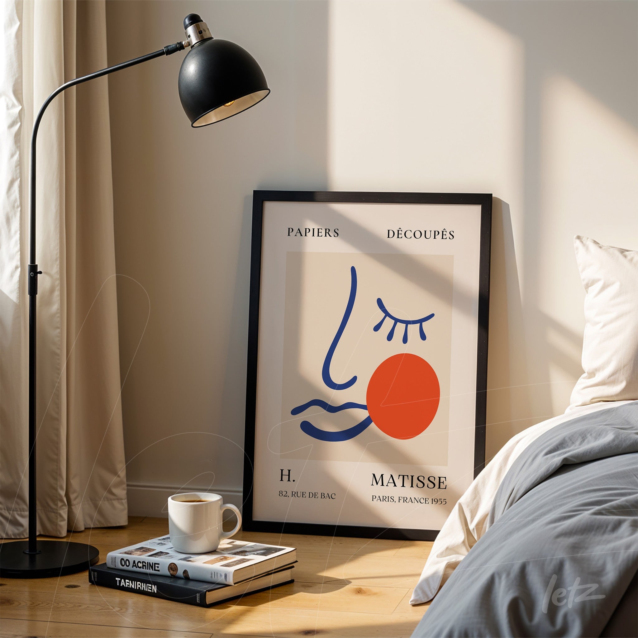 framed wall art of Matisse displayed next to a floor lamp in a cozy setting