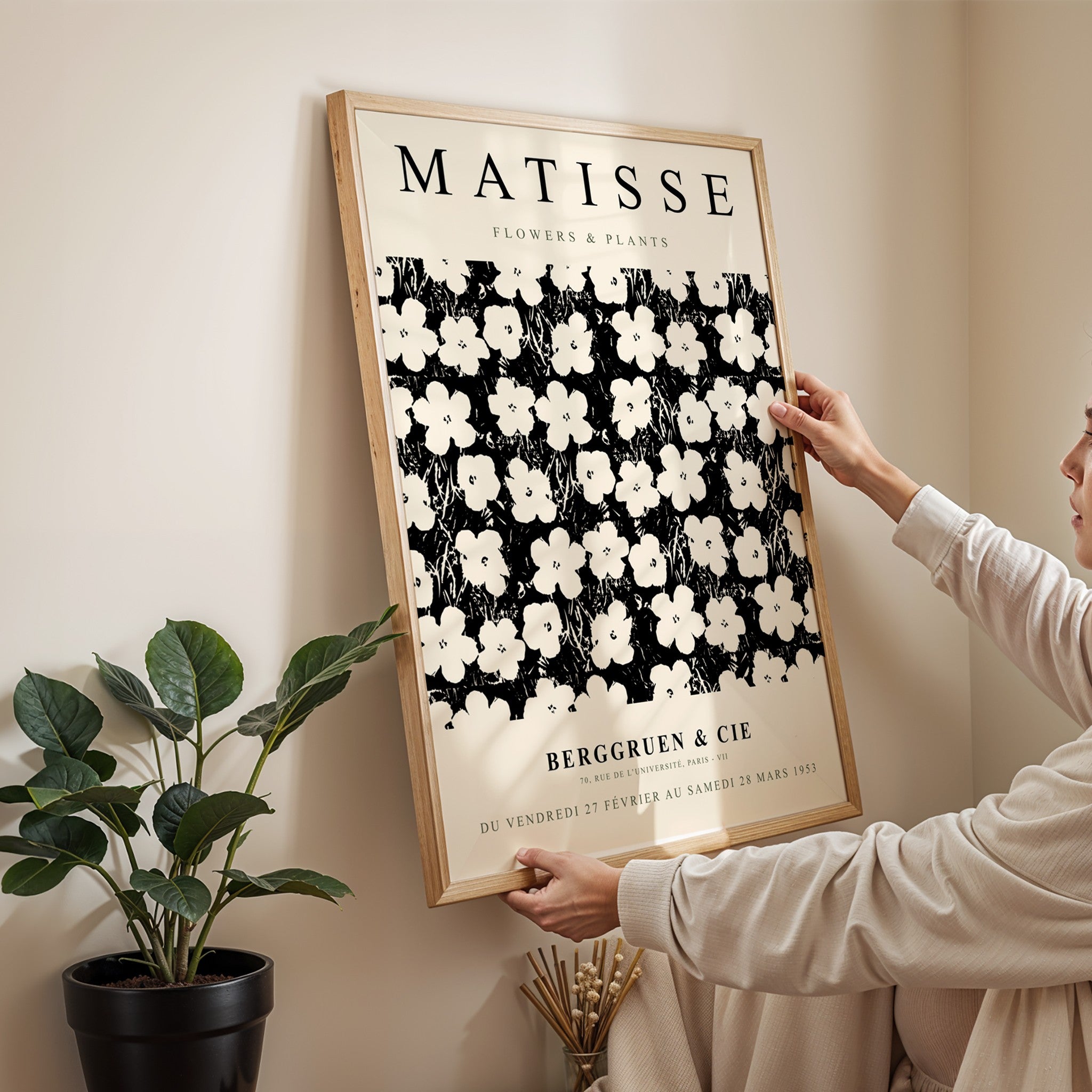 framed wall art featuring floral design by Matisse in light wood frame displayed on neutral wall