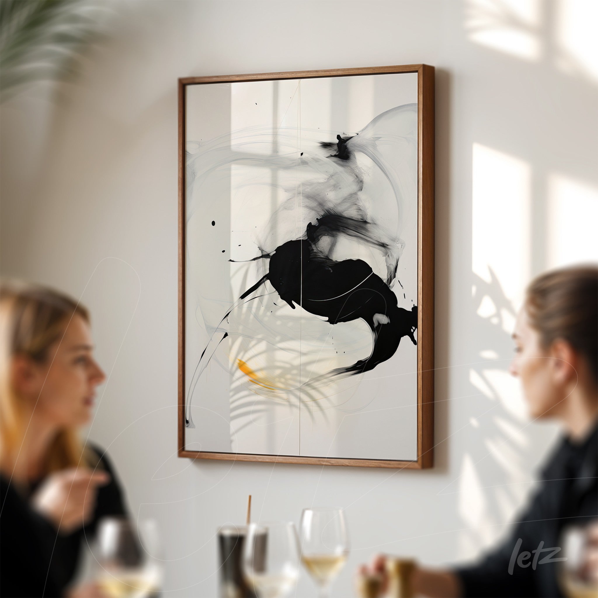 abstract artistic wall art in light wood frame featuring black strokes and yellow accents on well-lit wall