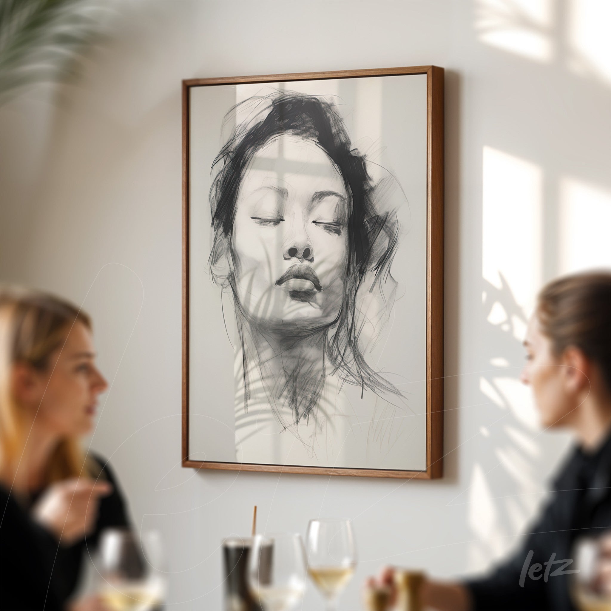 framed artwork of a softly sketched woman with pursed lips, light wood frame displayed in a well-lit setting with shadows