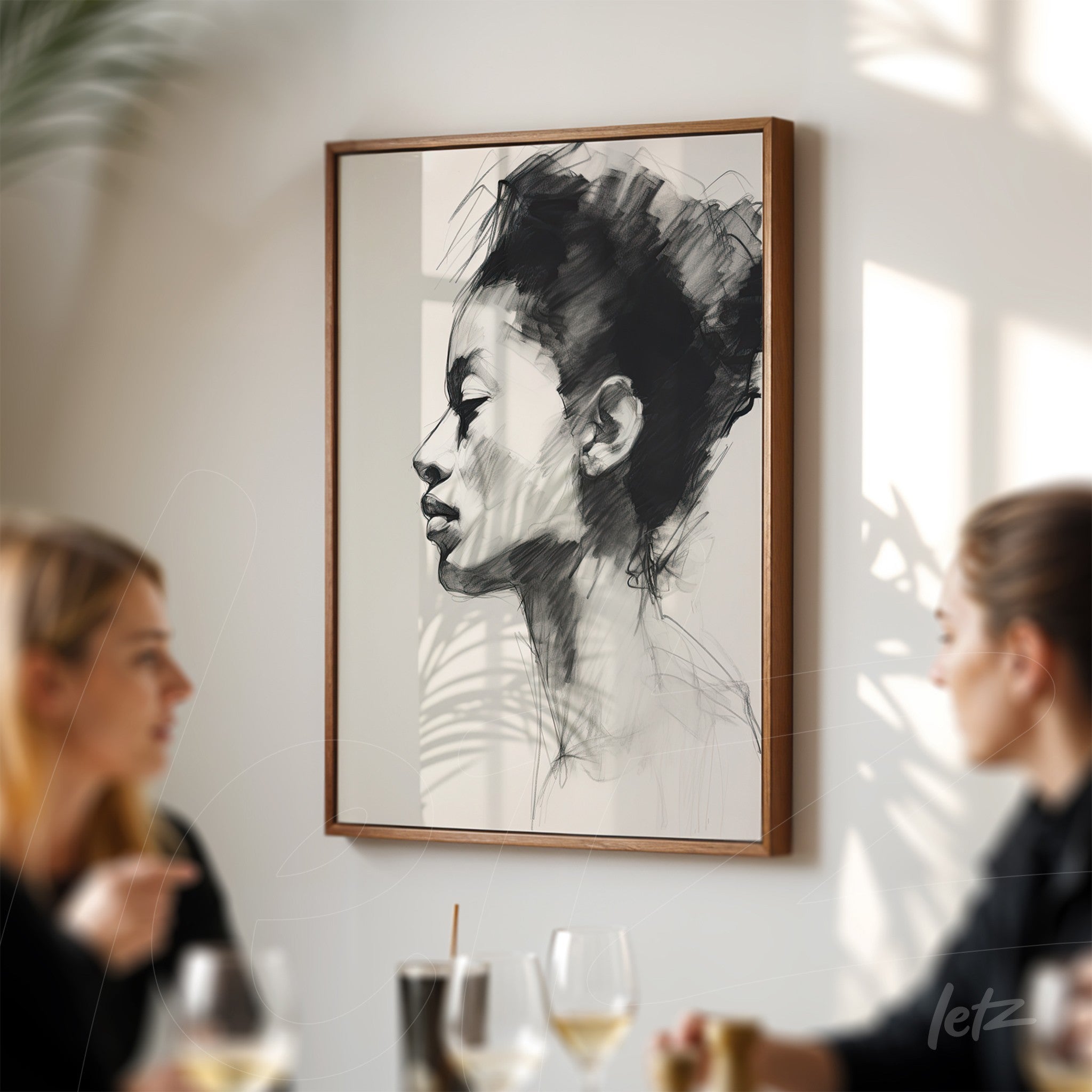 minimalist framed portrait of a female profile in light wood frame