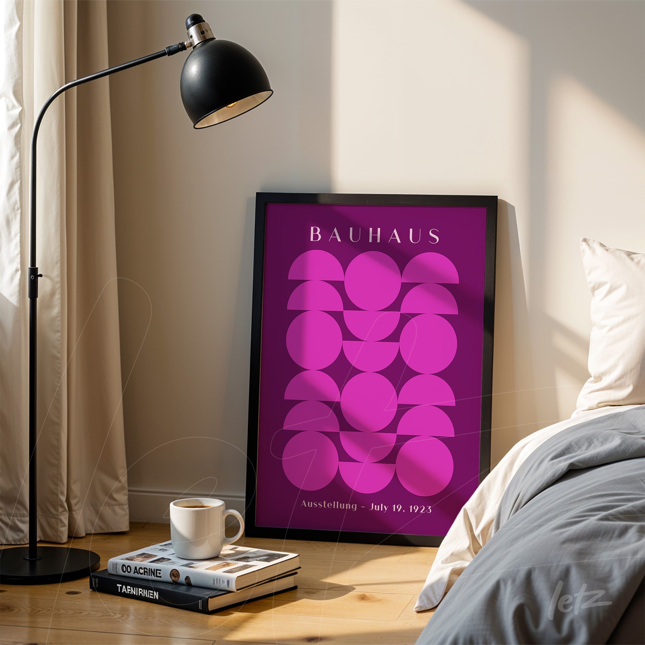 geometric illustration in shades of purple with black frame, resting on the floor next to a bed and a floor lamp