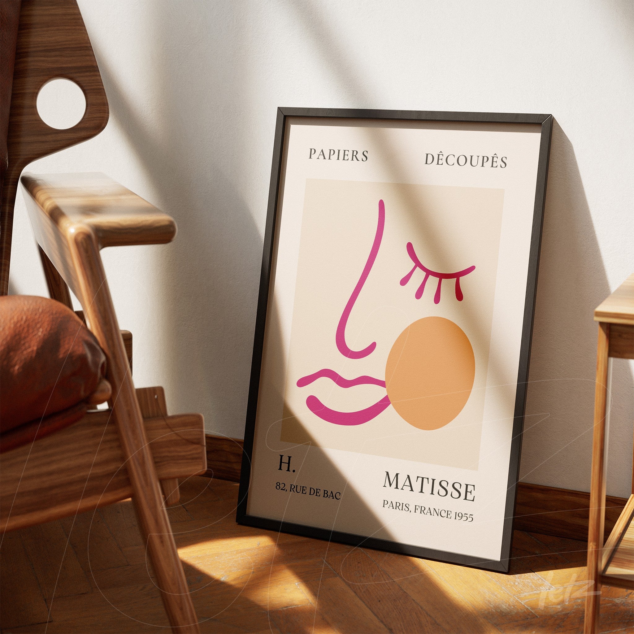 stylized artwork featuring a modern face in simple lines displayed next to a wooden chair on wooden flooring