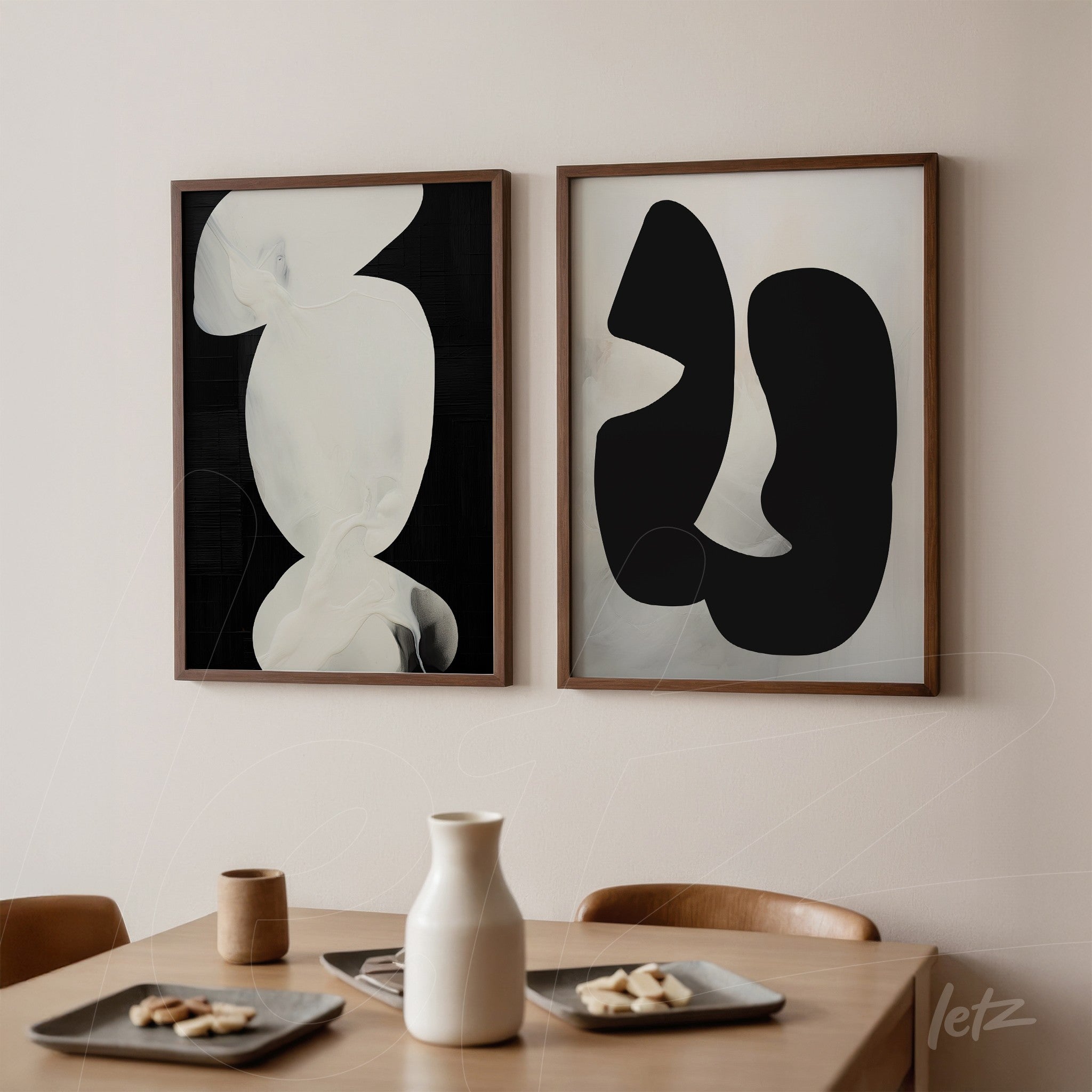 composition of abstract framed wall art in light wood featuring fluid shapes on black and white backgrounds