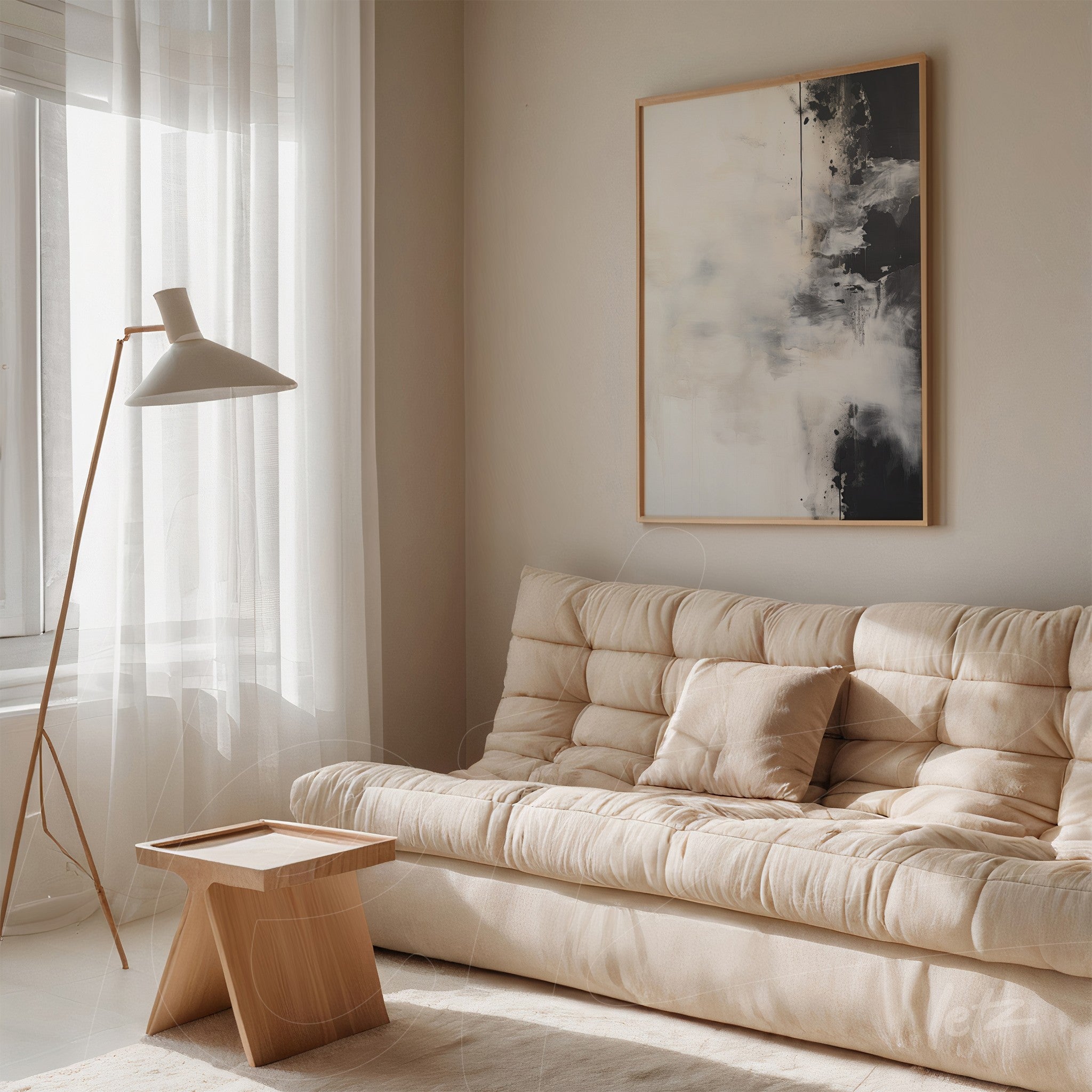 modern wall art featuring abstract design in neutral tones with light wood frame displayed on beige wall next to a light fabric sofa