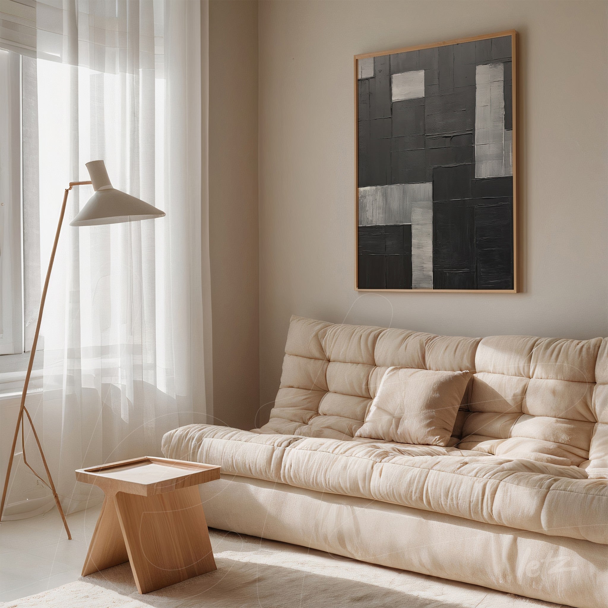 modern wall art featuring geometric shapes in black and gray within a light wood frame displayed in a minimalist setting