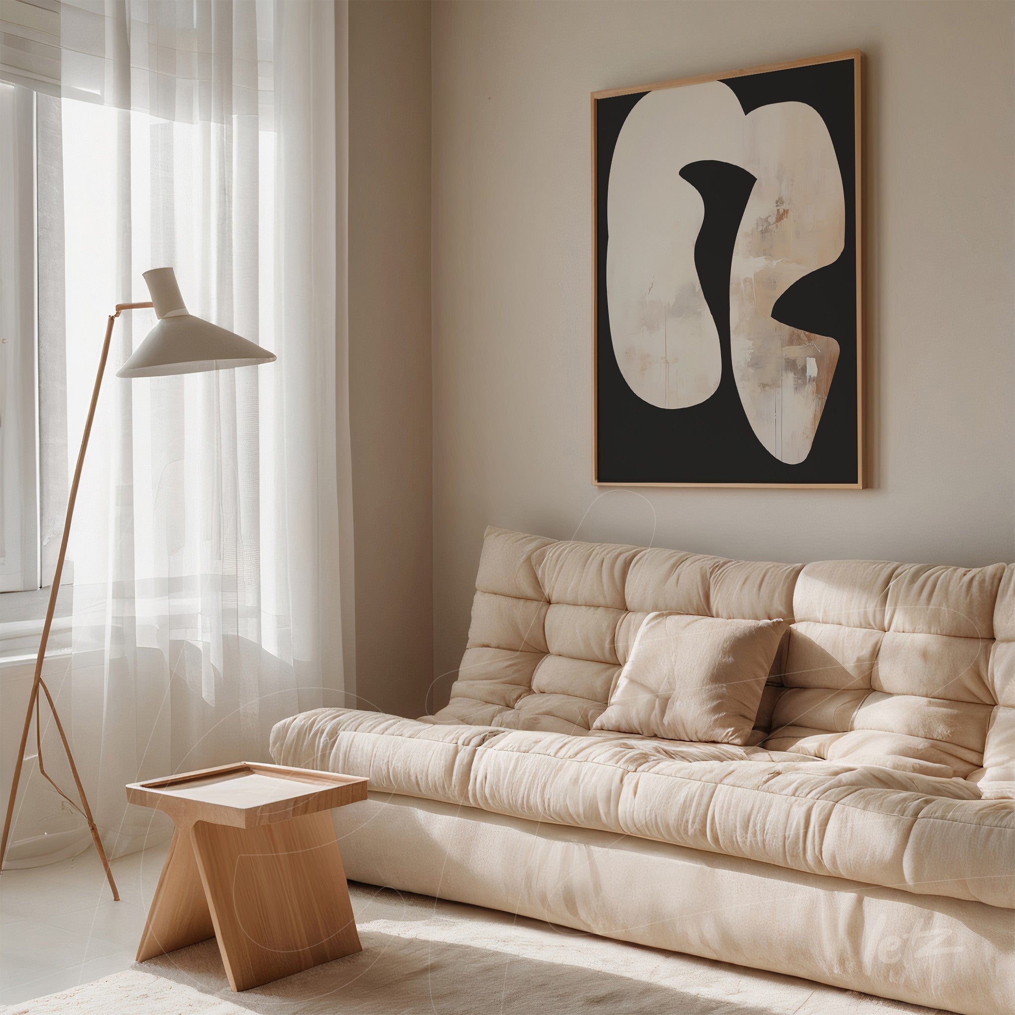 abstract wall art featuring light shapes on a dark background, framed in light wood, displayed in a cozy environment with a beige sofa and a floor lamp