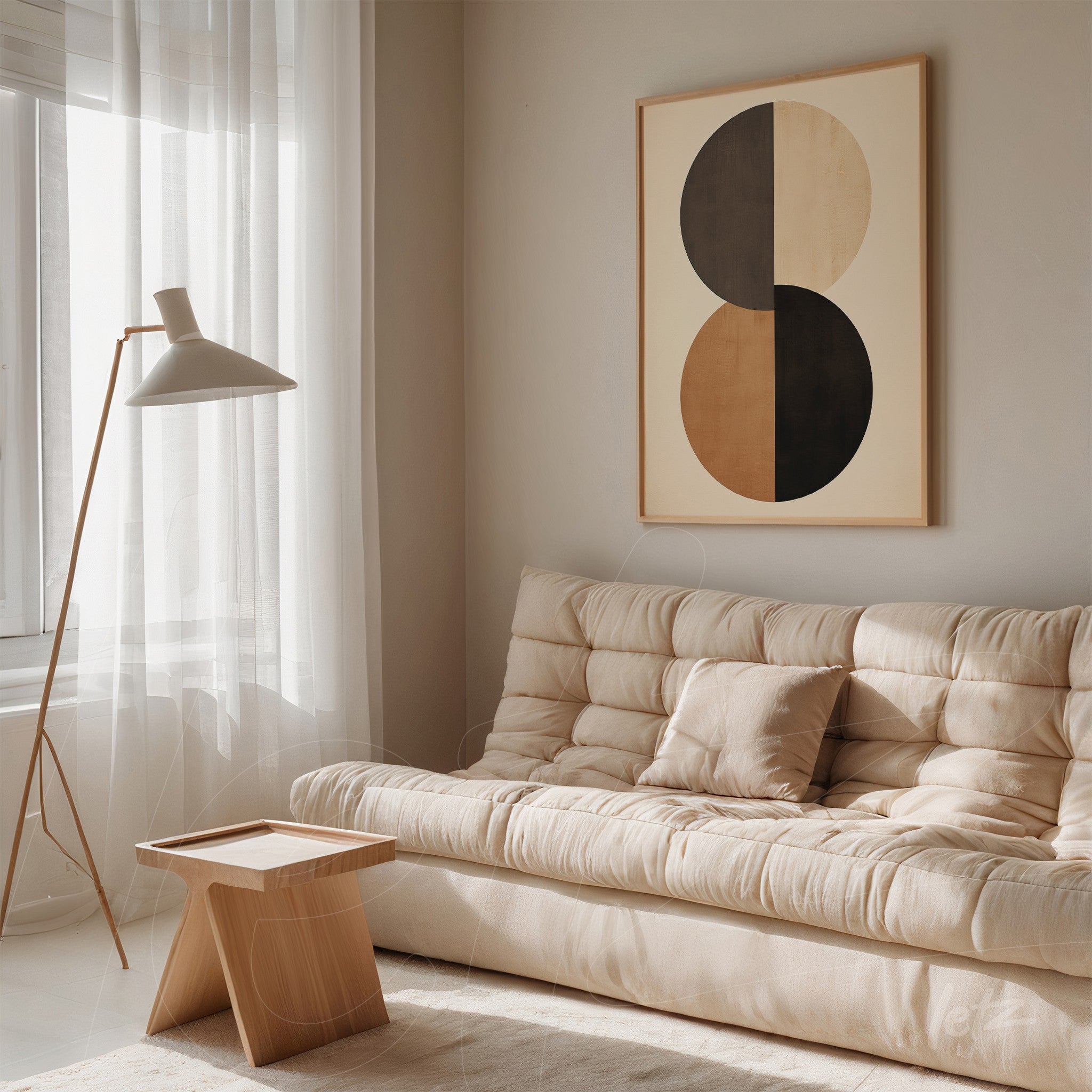modern framed wall art featuring black and beige circles beside light-colored sofa