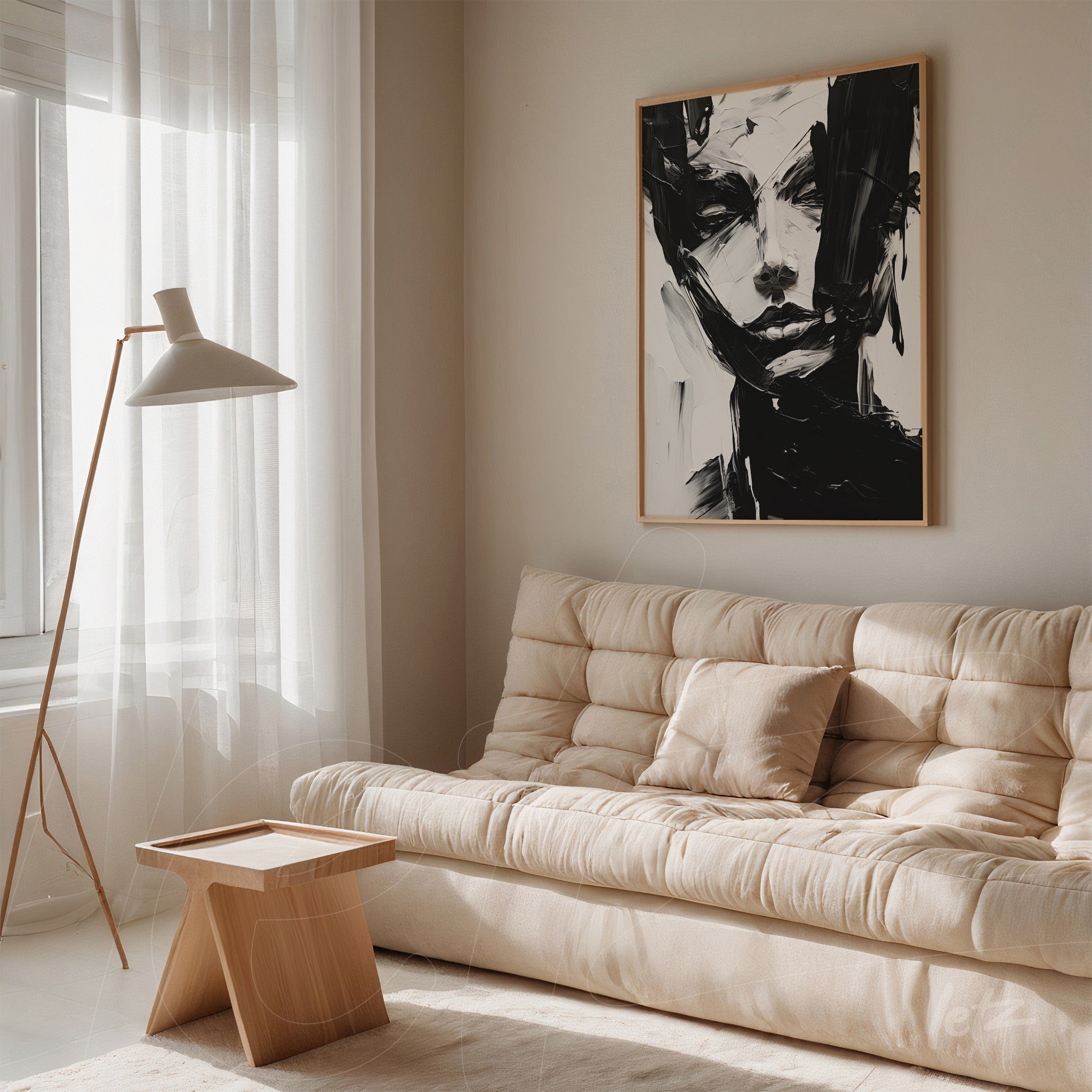 abstract black and white portrait in light frame displayed on neutral wall of living room with light sofa and wooden coffee table