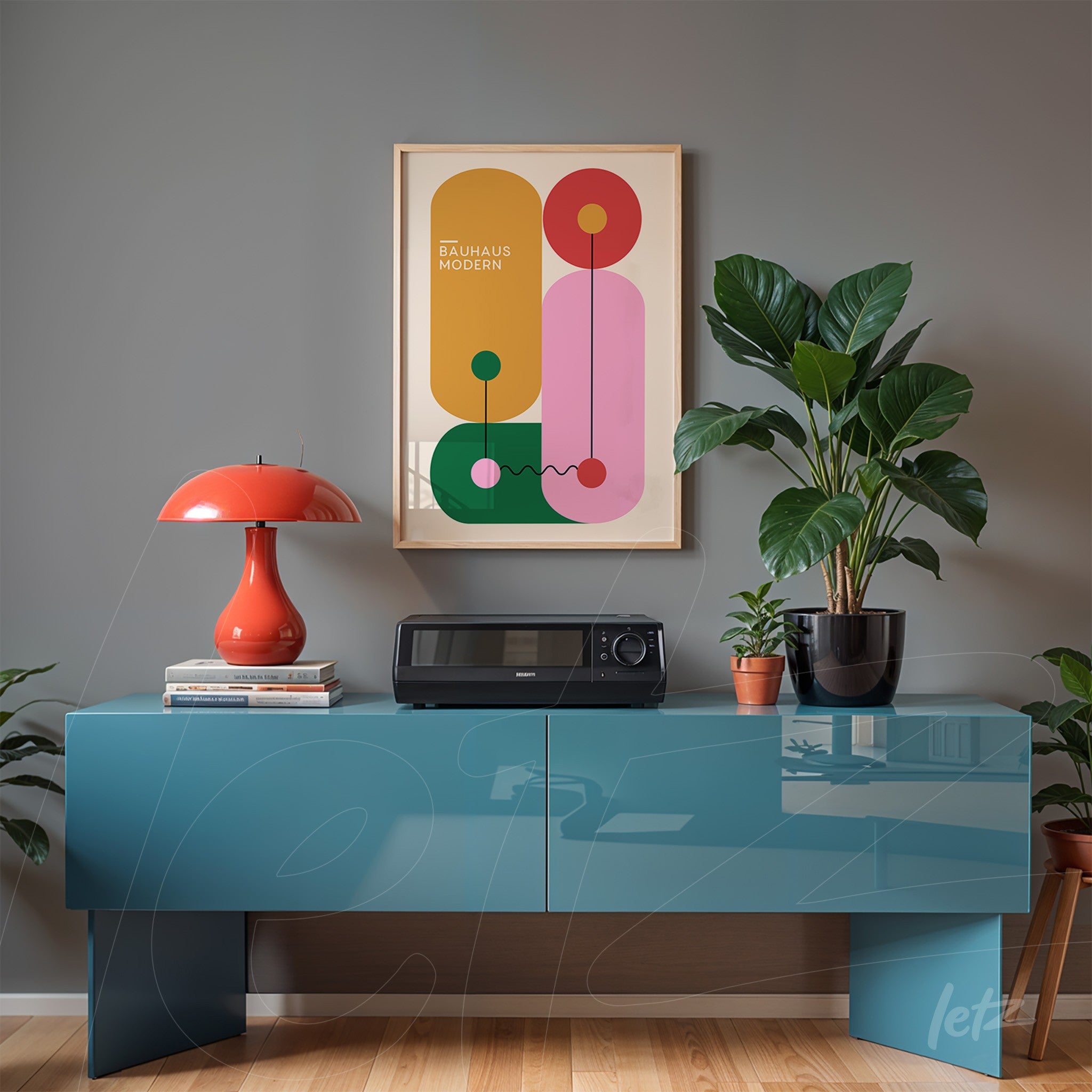framed poster with colorful geometric art on gray wall above blue sideboard with plants and table lamp