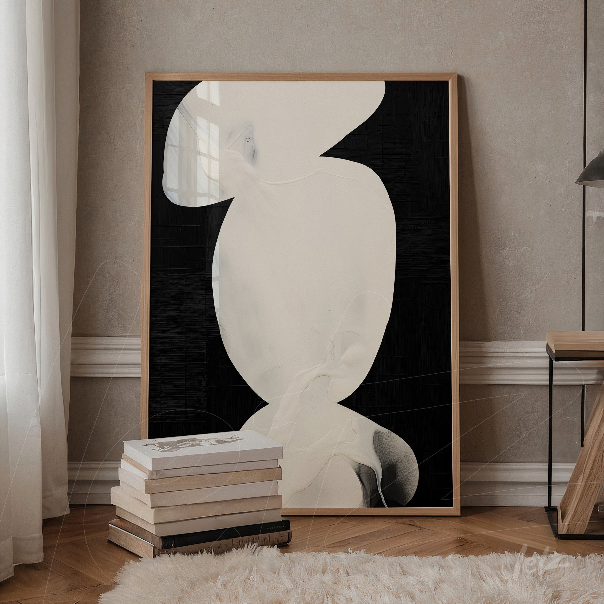 framed wall art with abstract design in shades of white on black background, displayed in a setting with wooden shelf