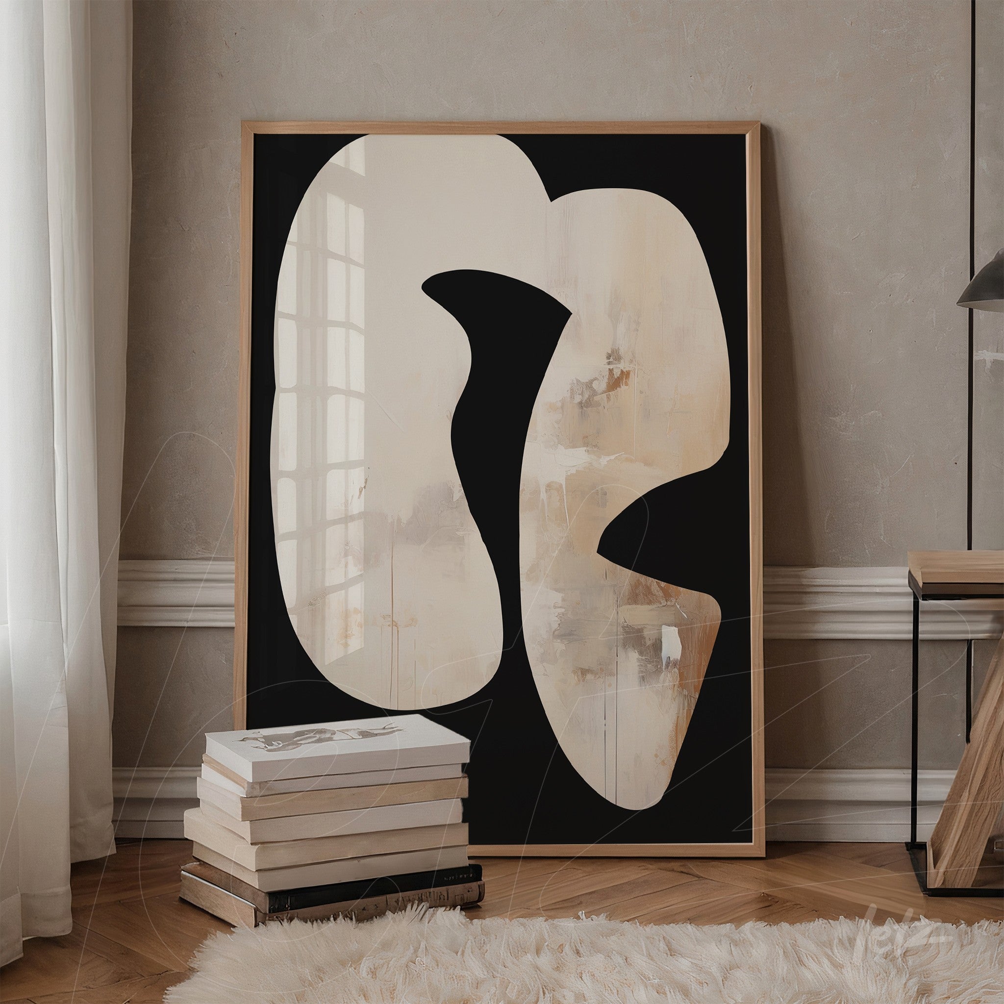 decorative artwork featuring abstract white and beige shapes on a black background in a light wood frame