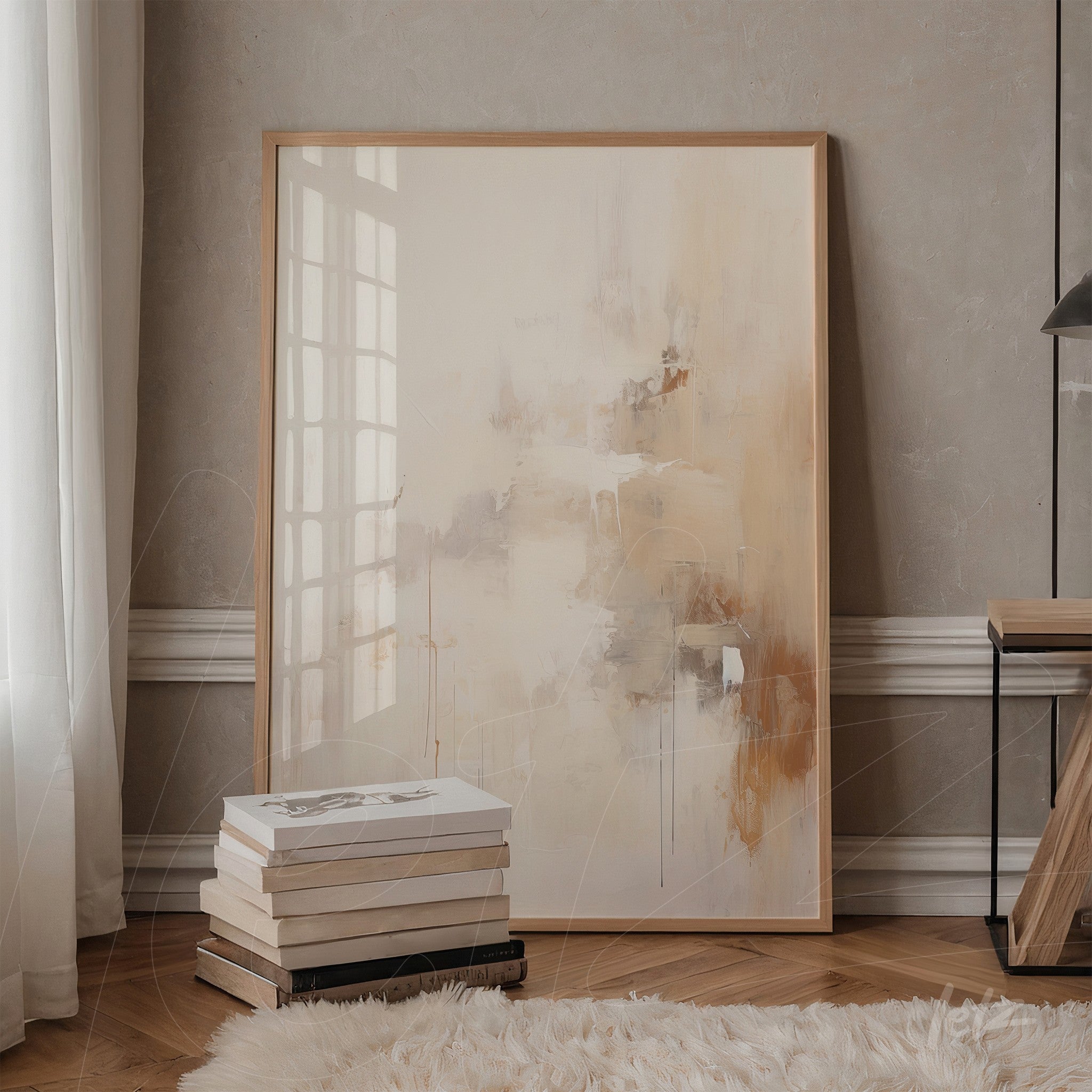 abstract artwork in earthy tones with a light wooden frame, leaning against a shelf next to a stack of books