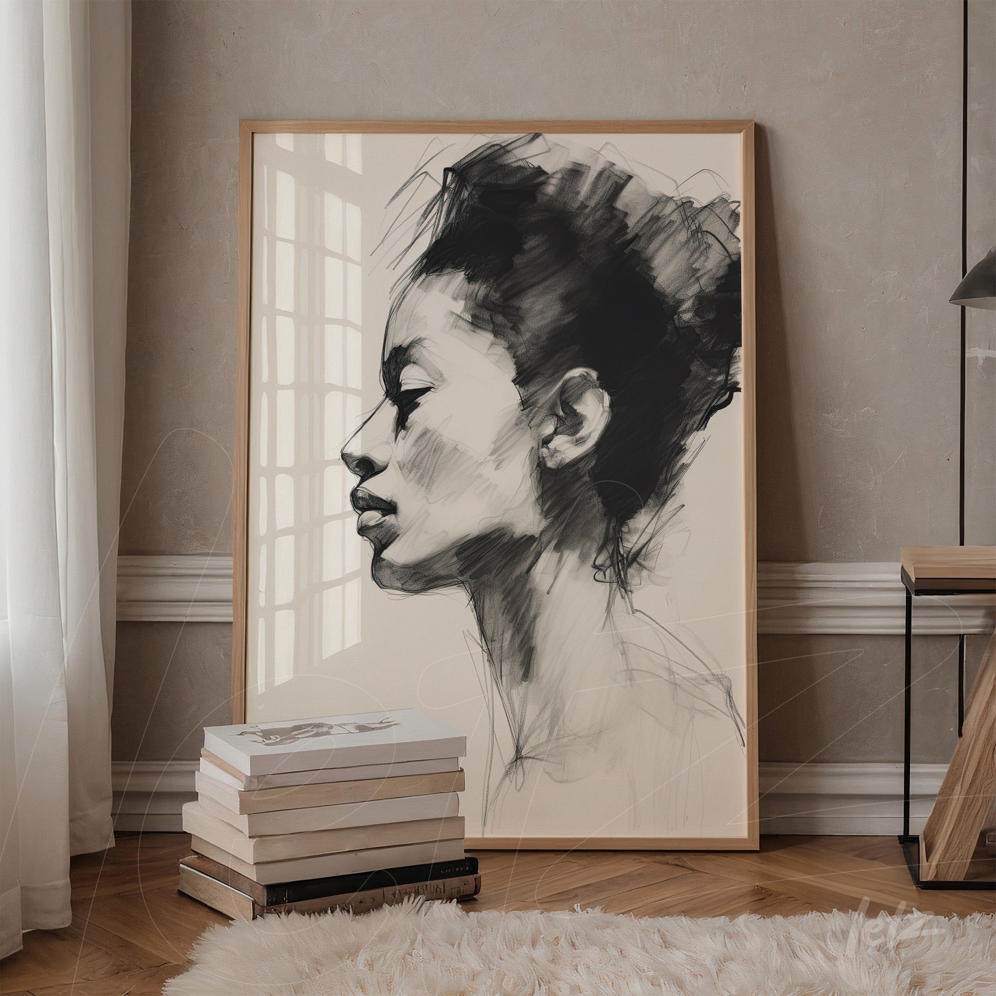 framed wall art in black and white depicting the profile of a woman, displayed in an interior with beige wall
