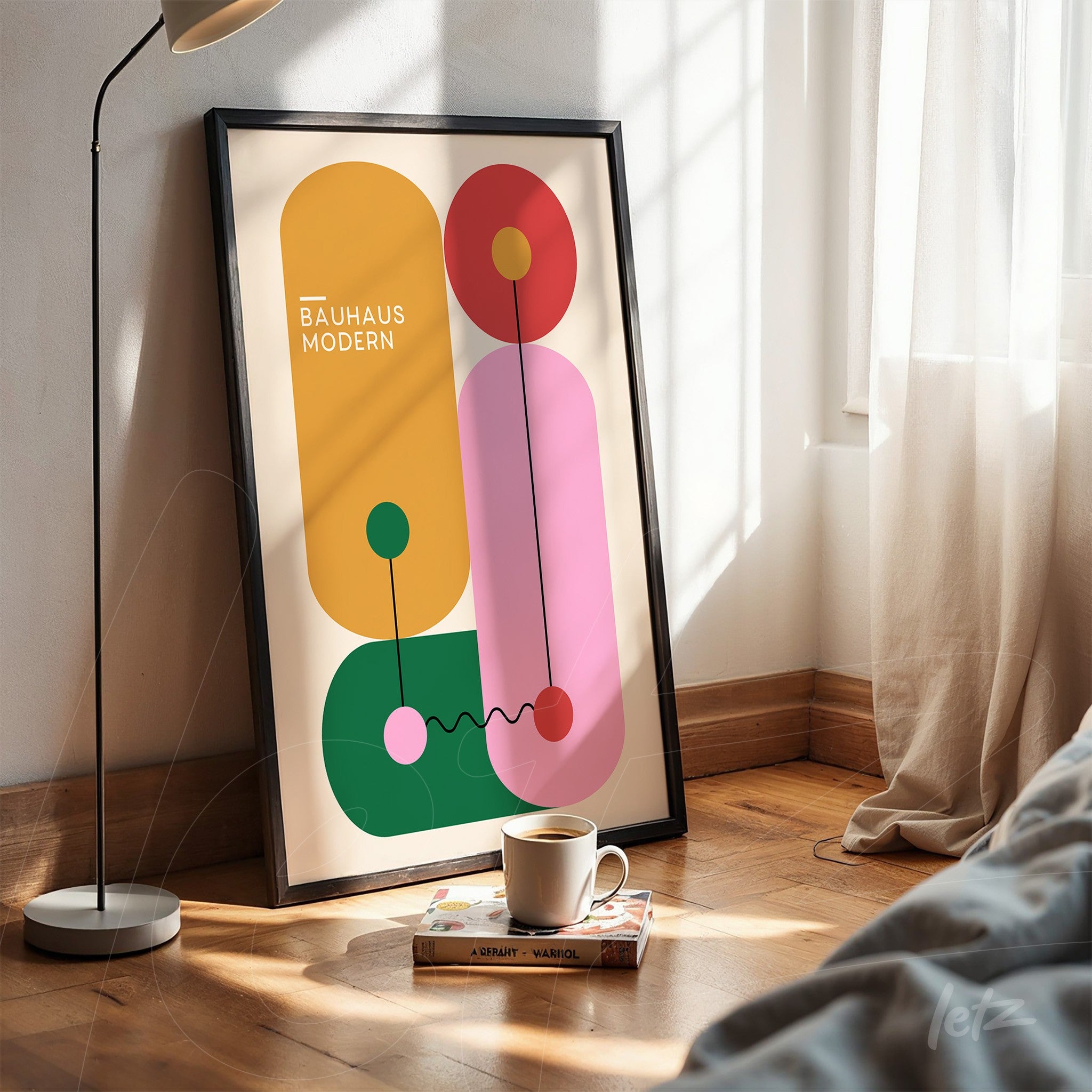 modern art with colorful geometric shapes and 'bauhaus modern' text in a black frame, displayed in a setting with wooden floor and curtain at the right