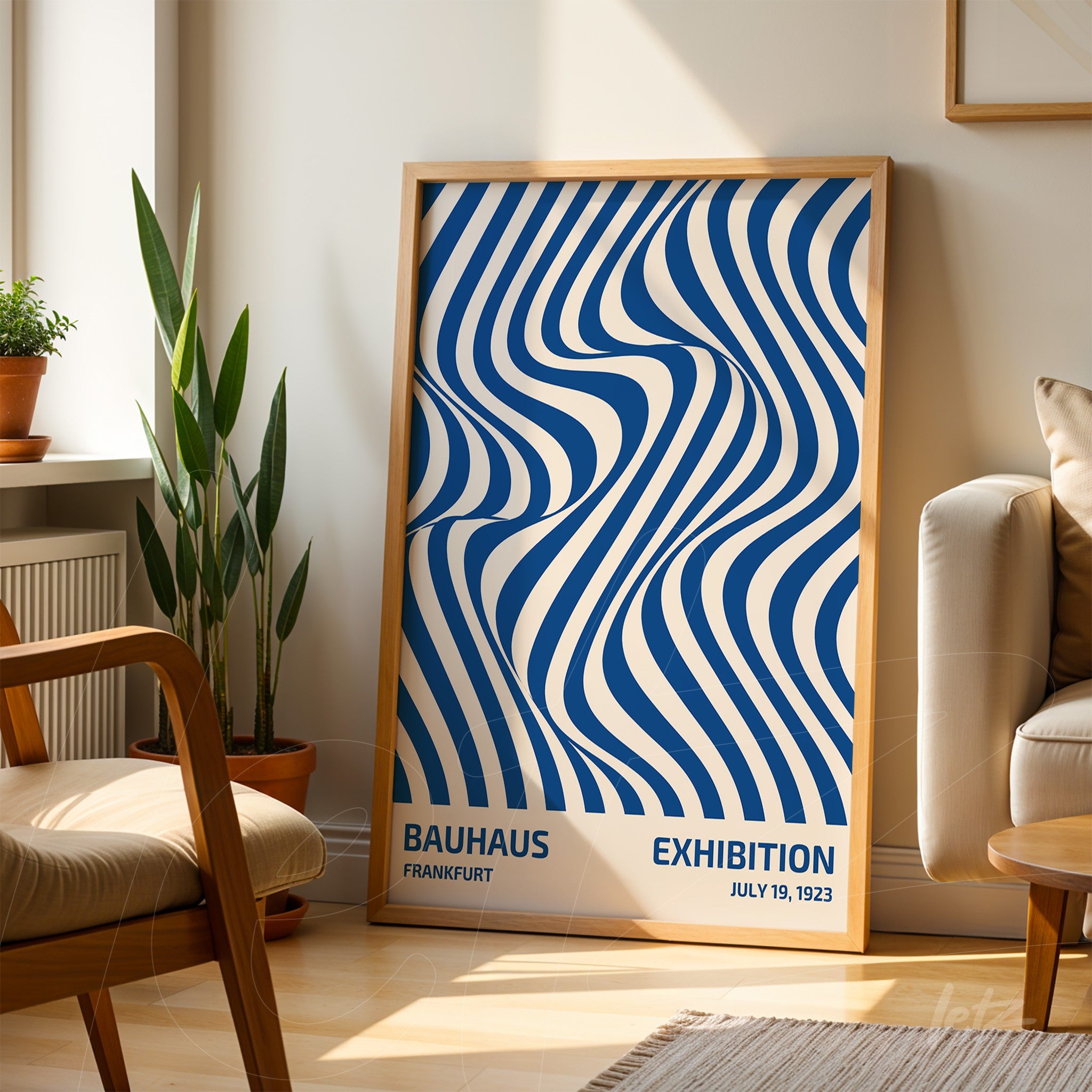poster with wavy geometric blue and white illustration in light wood frame, leaning in a bright room