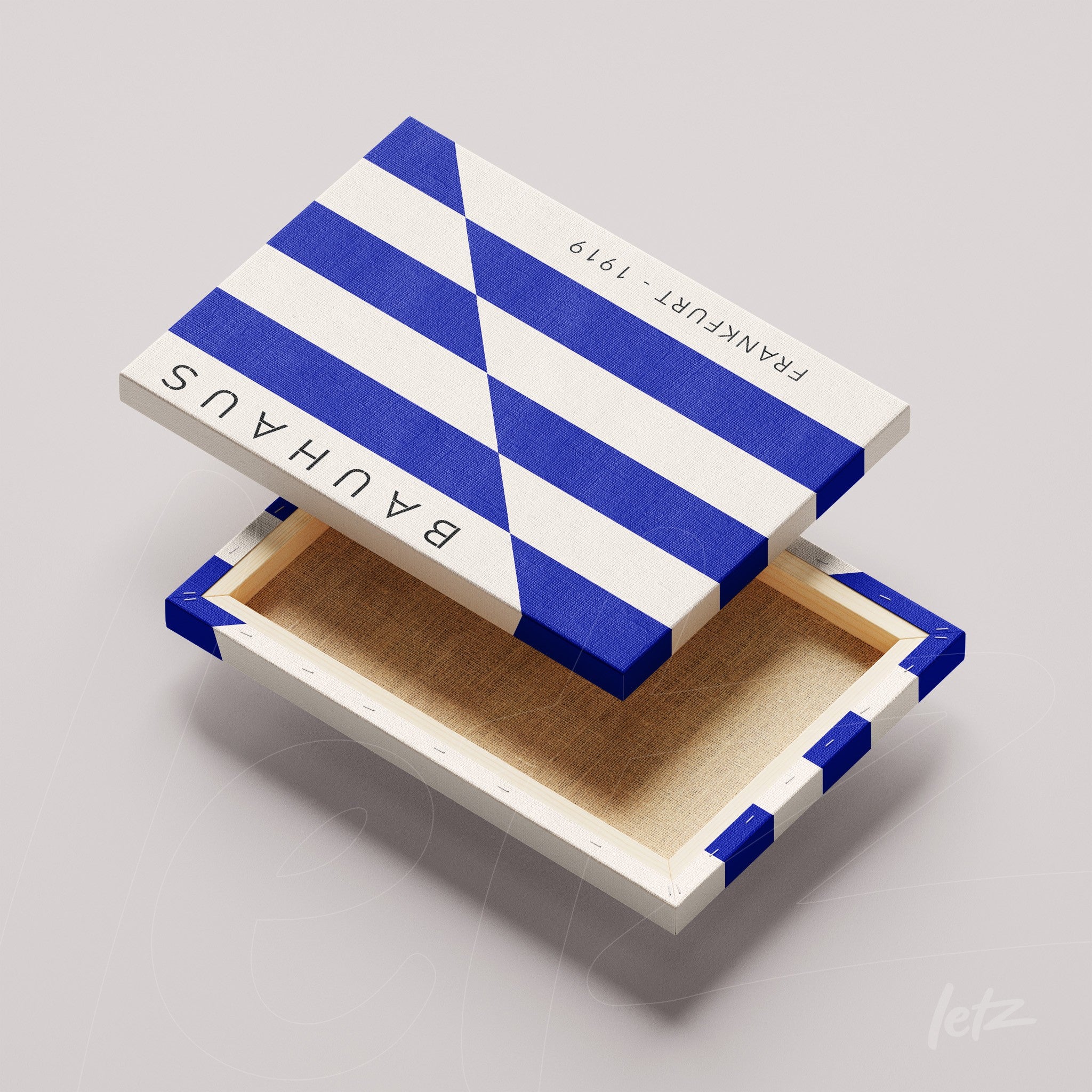 canvas print featuring geometric bauhaus design in blue and white displayed on a light surface