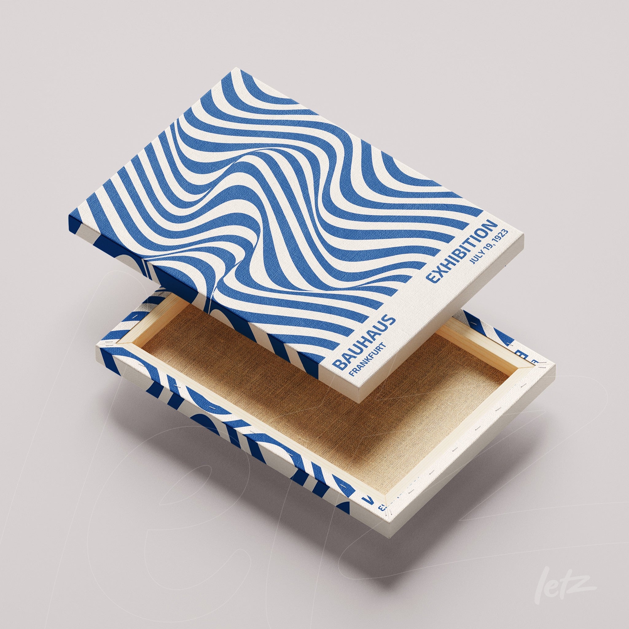 decorative box with blue wavy pattern and text about Bauhaus exhibition with lid removed