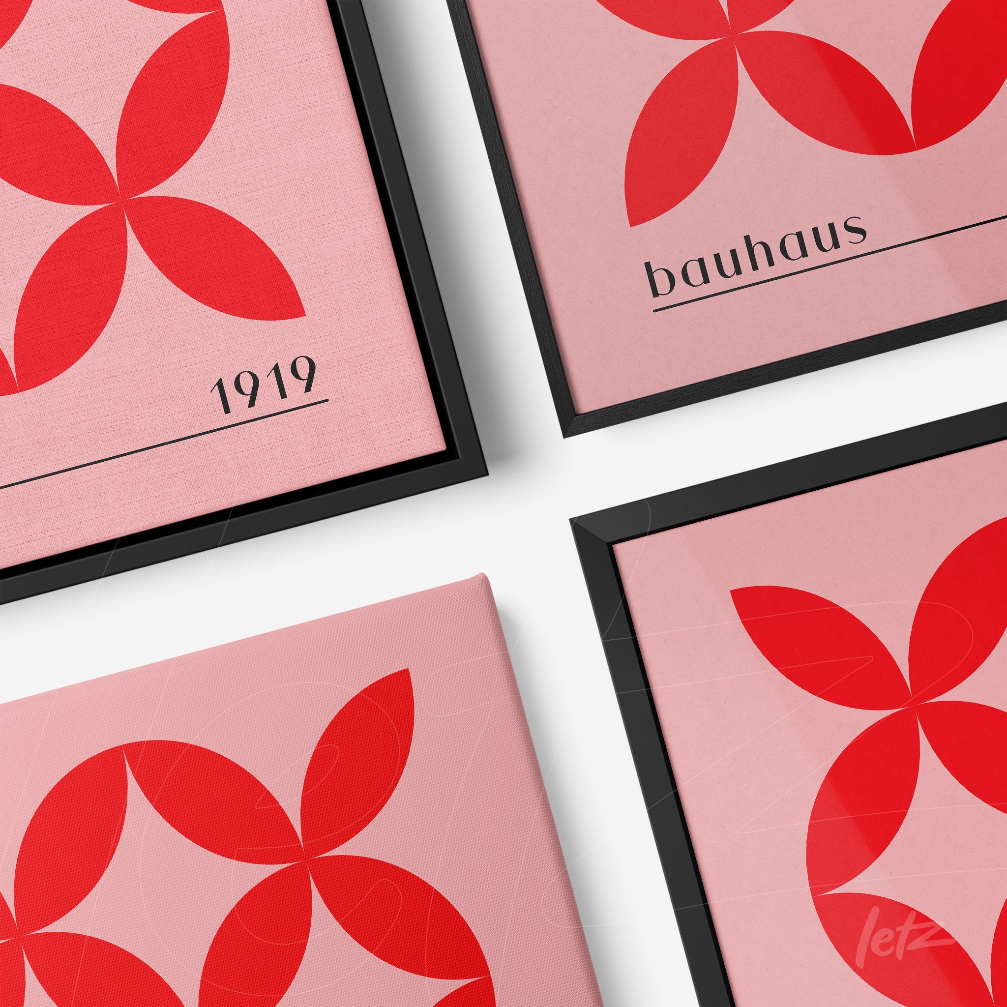 set of bauhaus style wall art with red geometric shapes in black frames