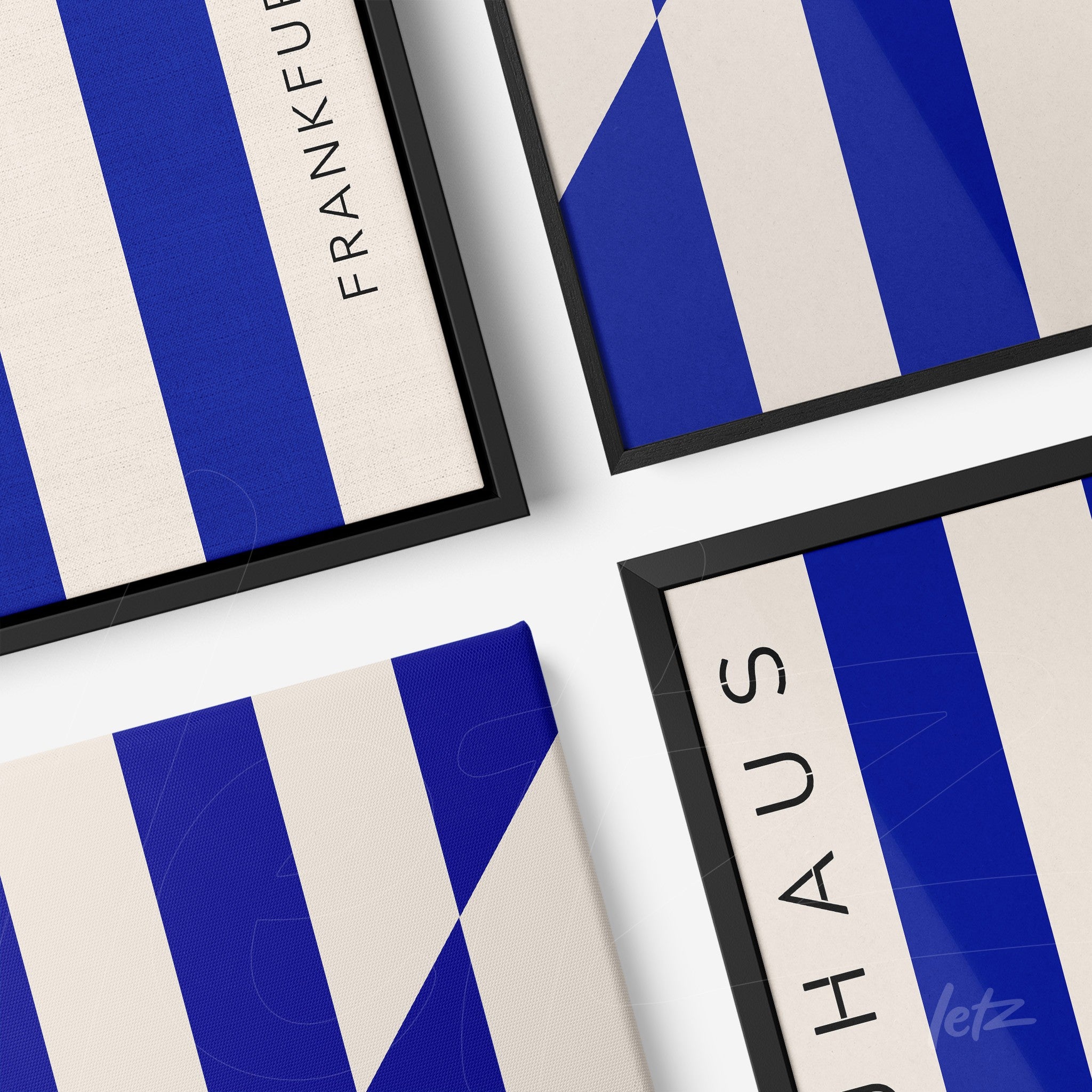 decorative wall art featuring geometric design in blue and beige with black frame