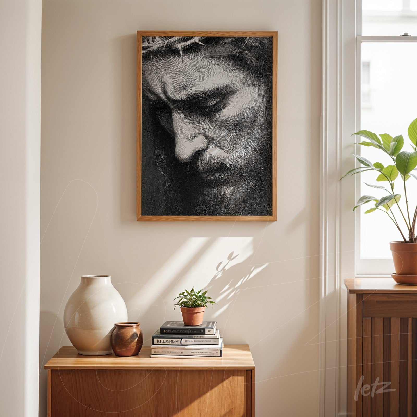 framed black and white artwork depicting a solemn man with a serious expression, displayed on a shelf next to ceramic pots