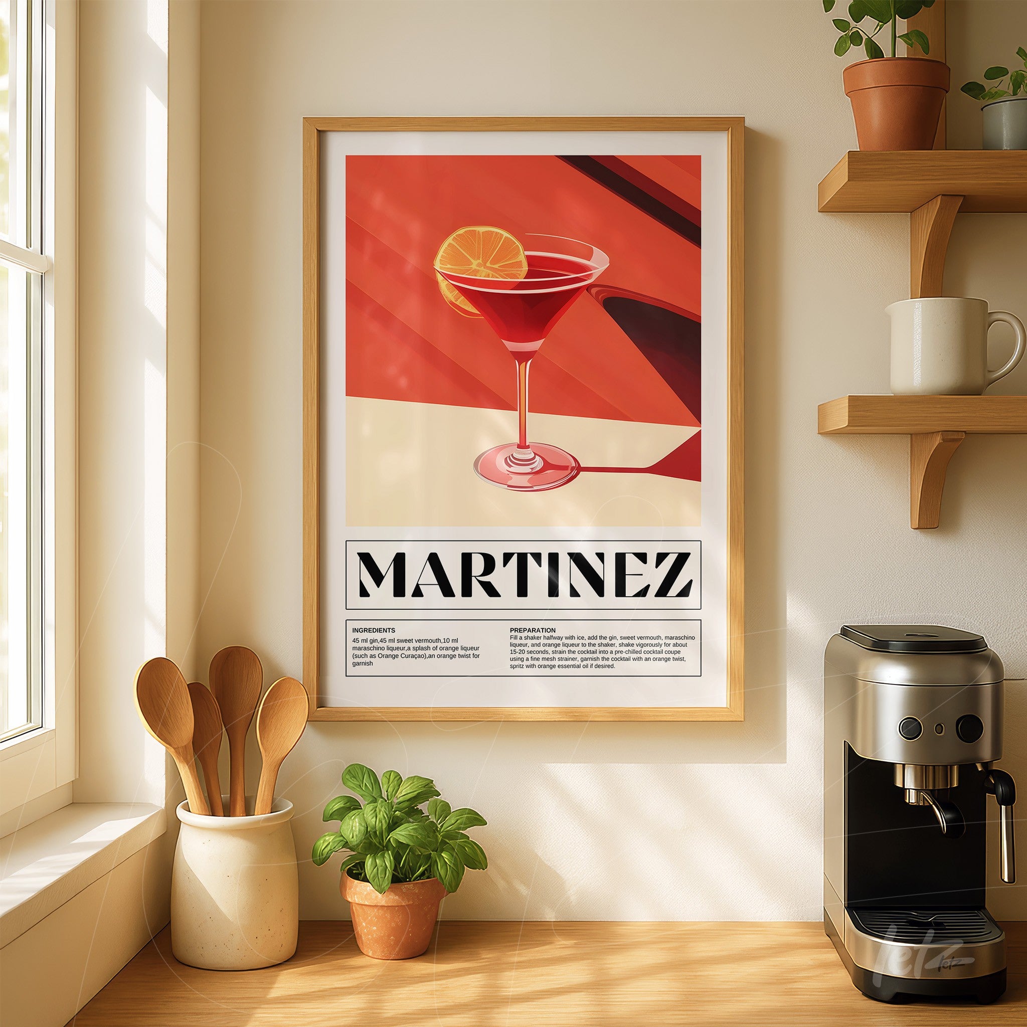 framed art of martinez cocktail in light wood frame displayed on a well-lit wall next to a wooden shelf with kitchen utensils and a potted plant