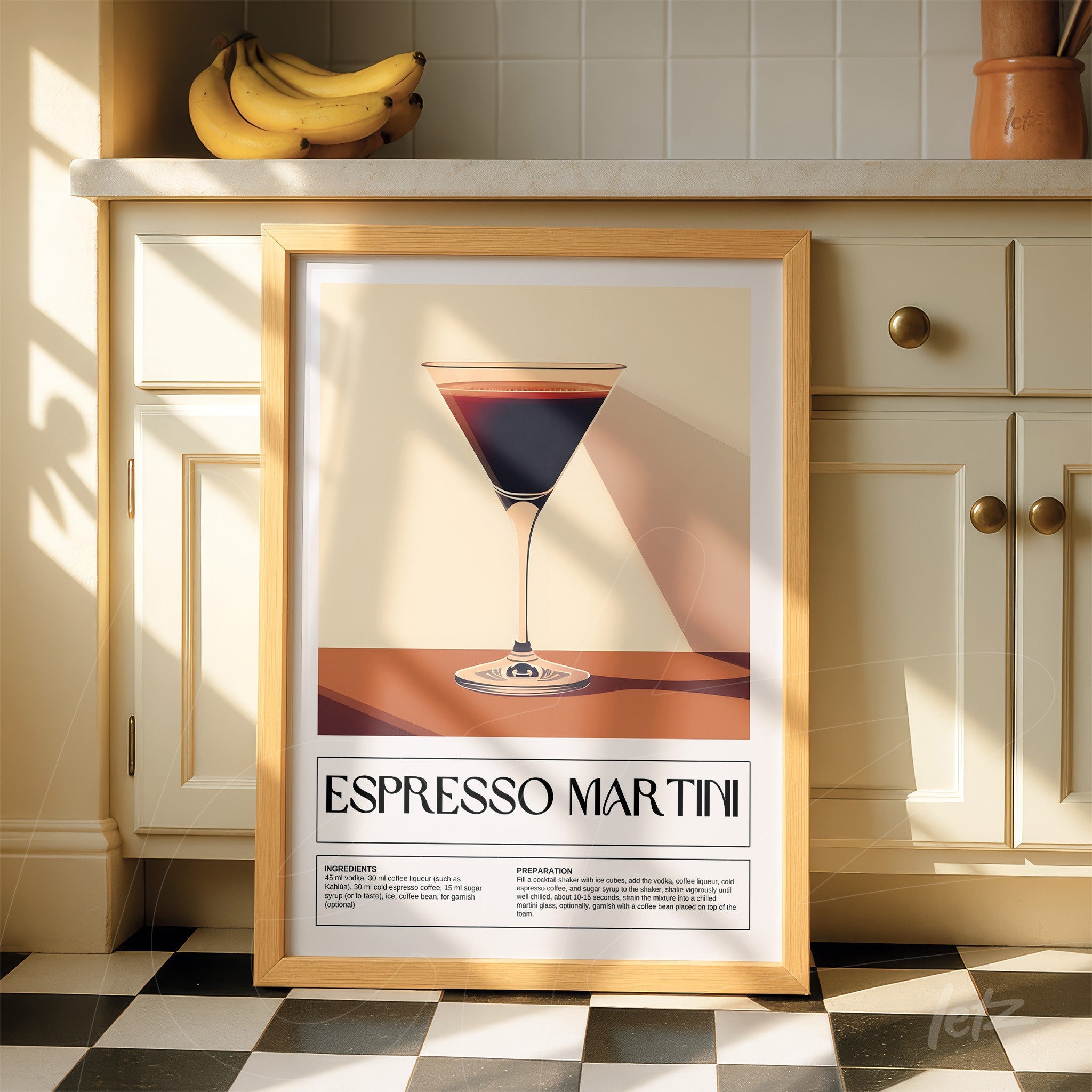 framed artwork featuring a minimalist illustration of espresso martini displayed against a light kitchen wall with natural sunlight