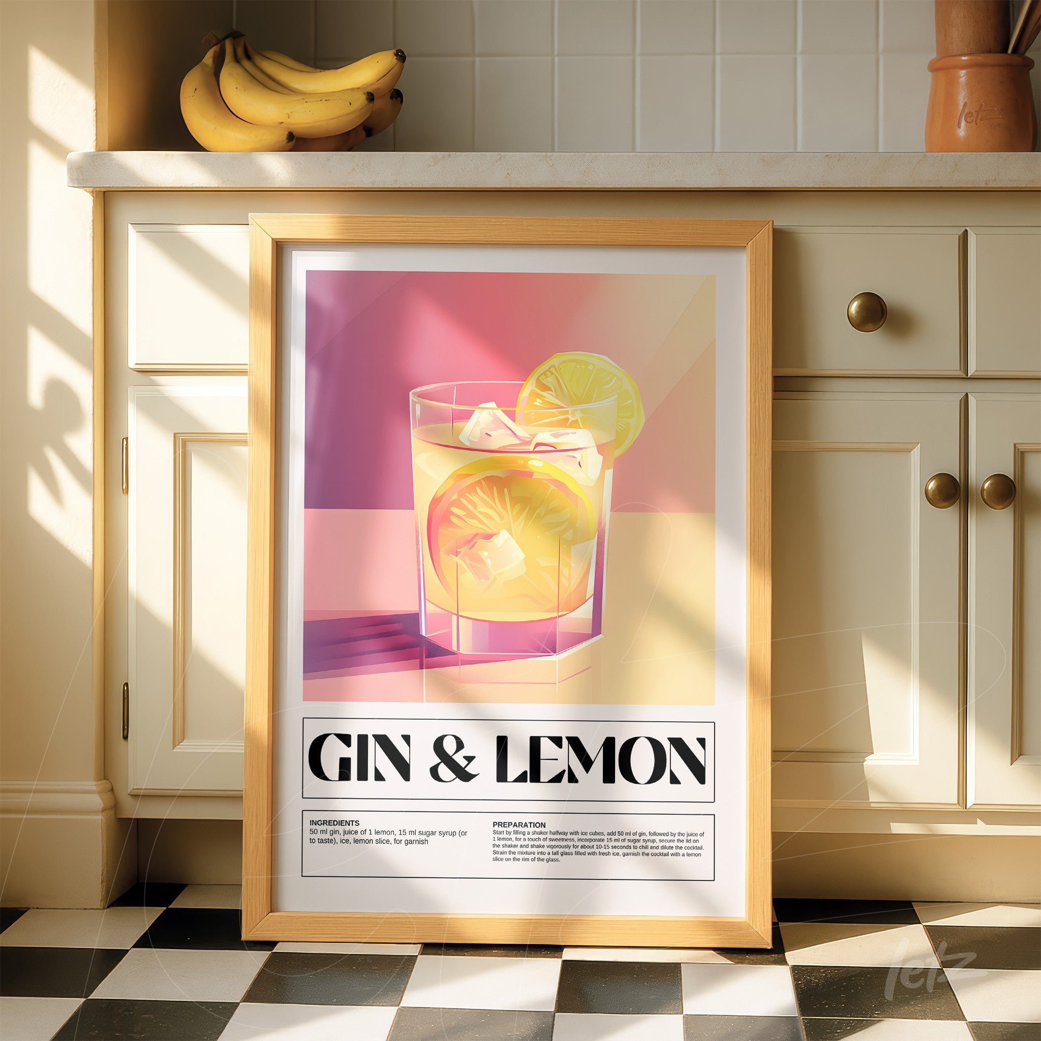 modern framed wall art of gin and lemon cocktail with light wood frame
