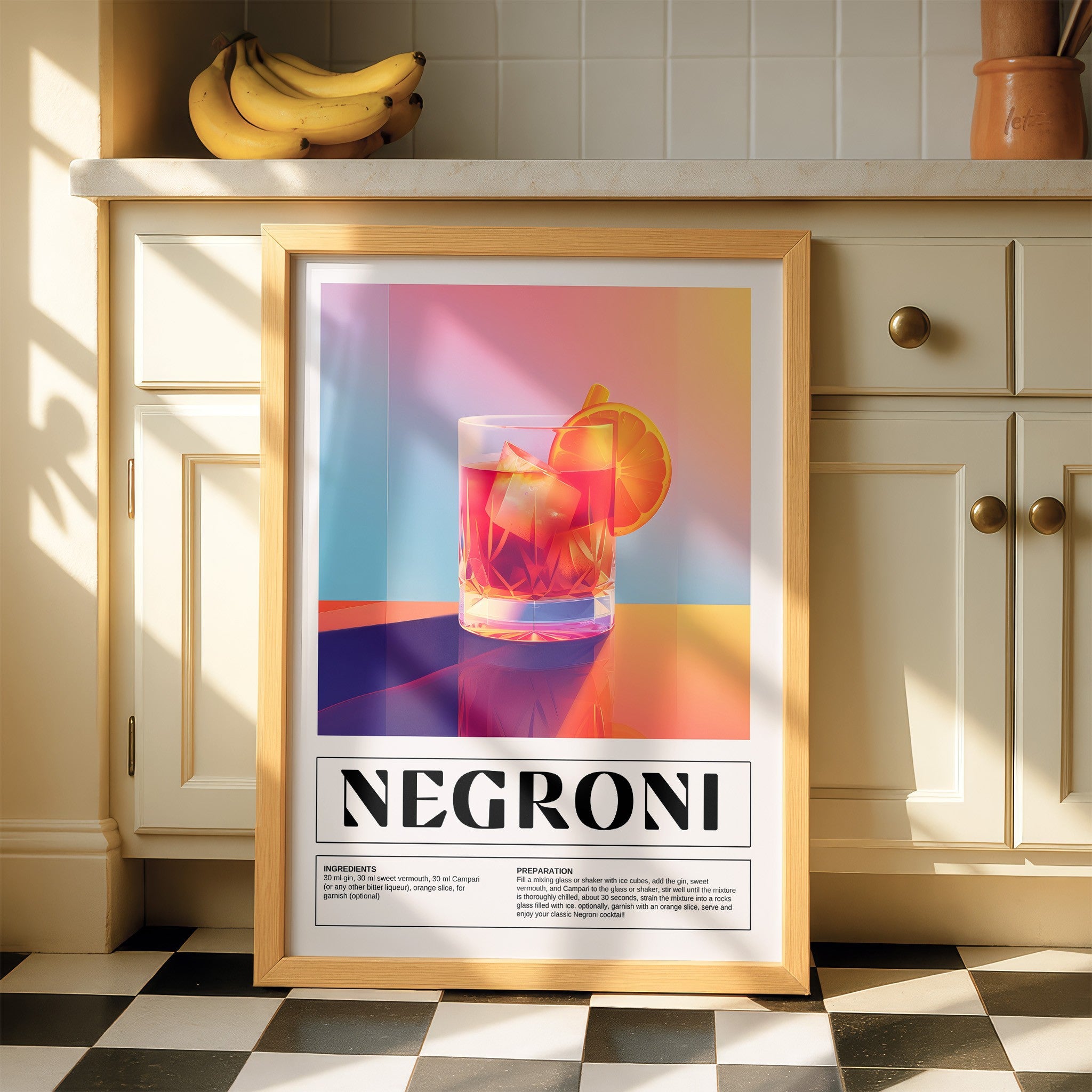 framed wall art of negroni cocktail in light frame displayed in a kitchen setting with natural sunlight