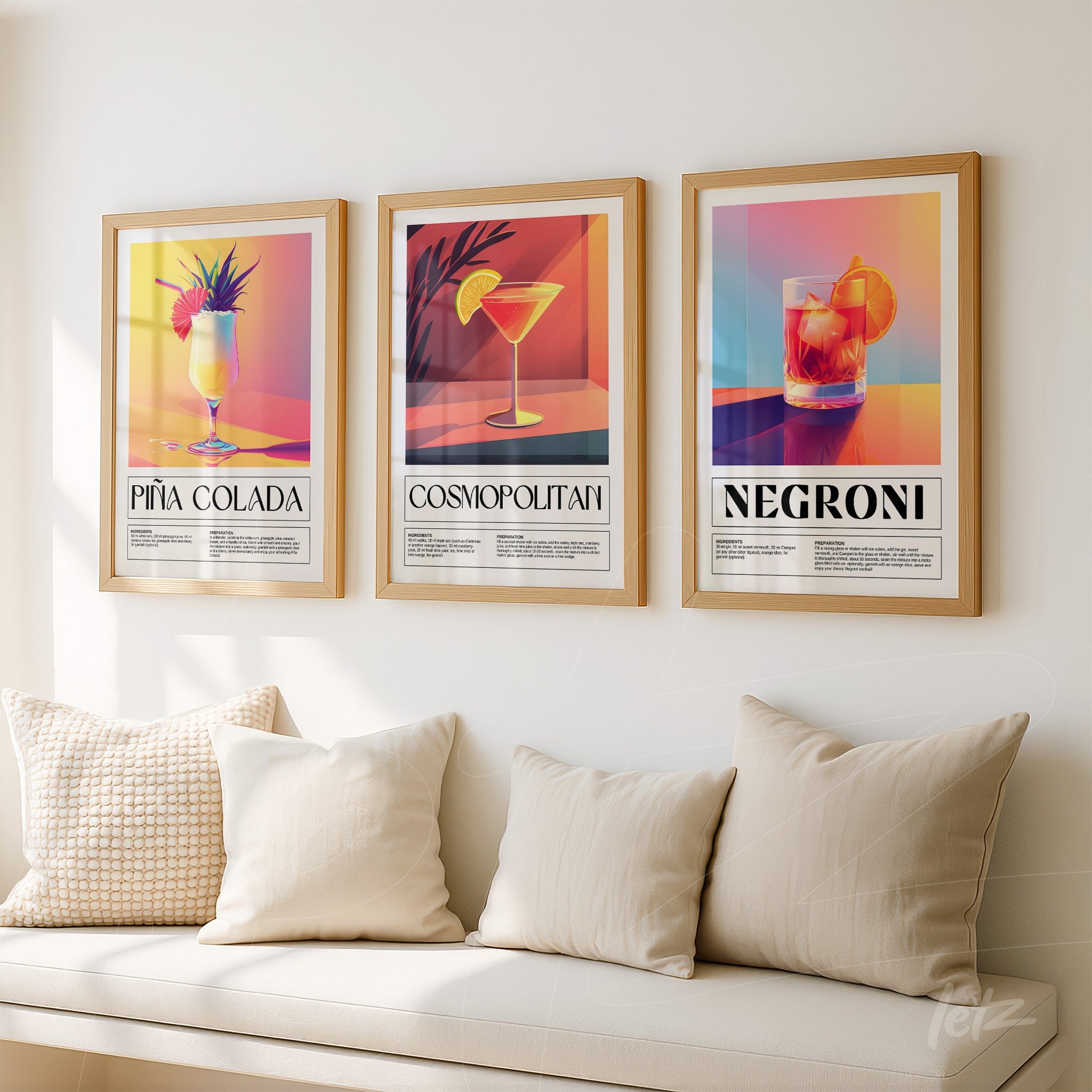 collection of framed wall art featuring cocktails piña colada, cosmopolitan, and negroni with colorful backgrounds in golden frames