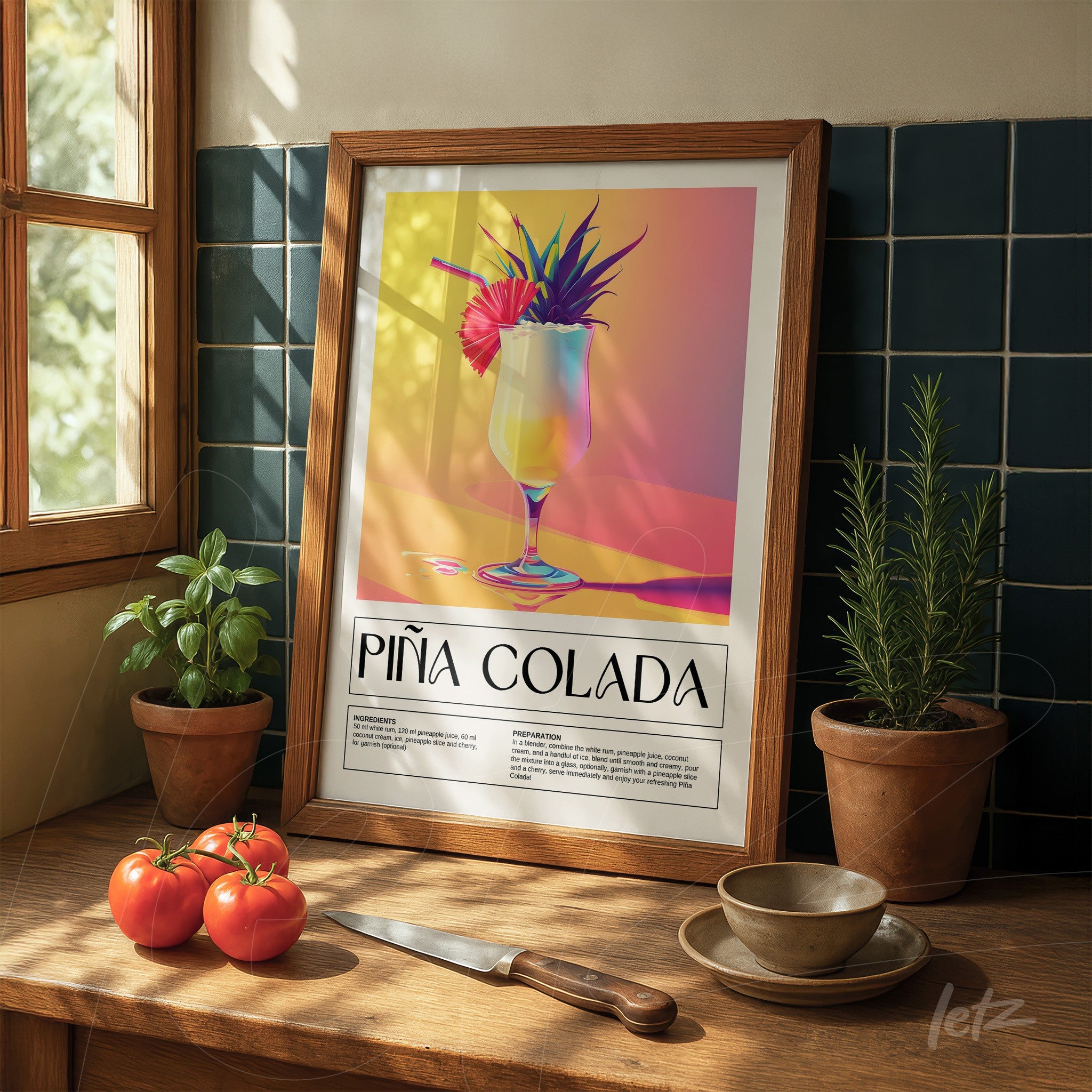 framed colorful art of piña colada cocktail displayed on wooden table next to tomatoes and plants