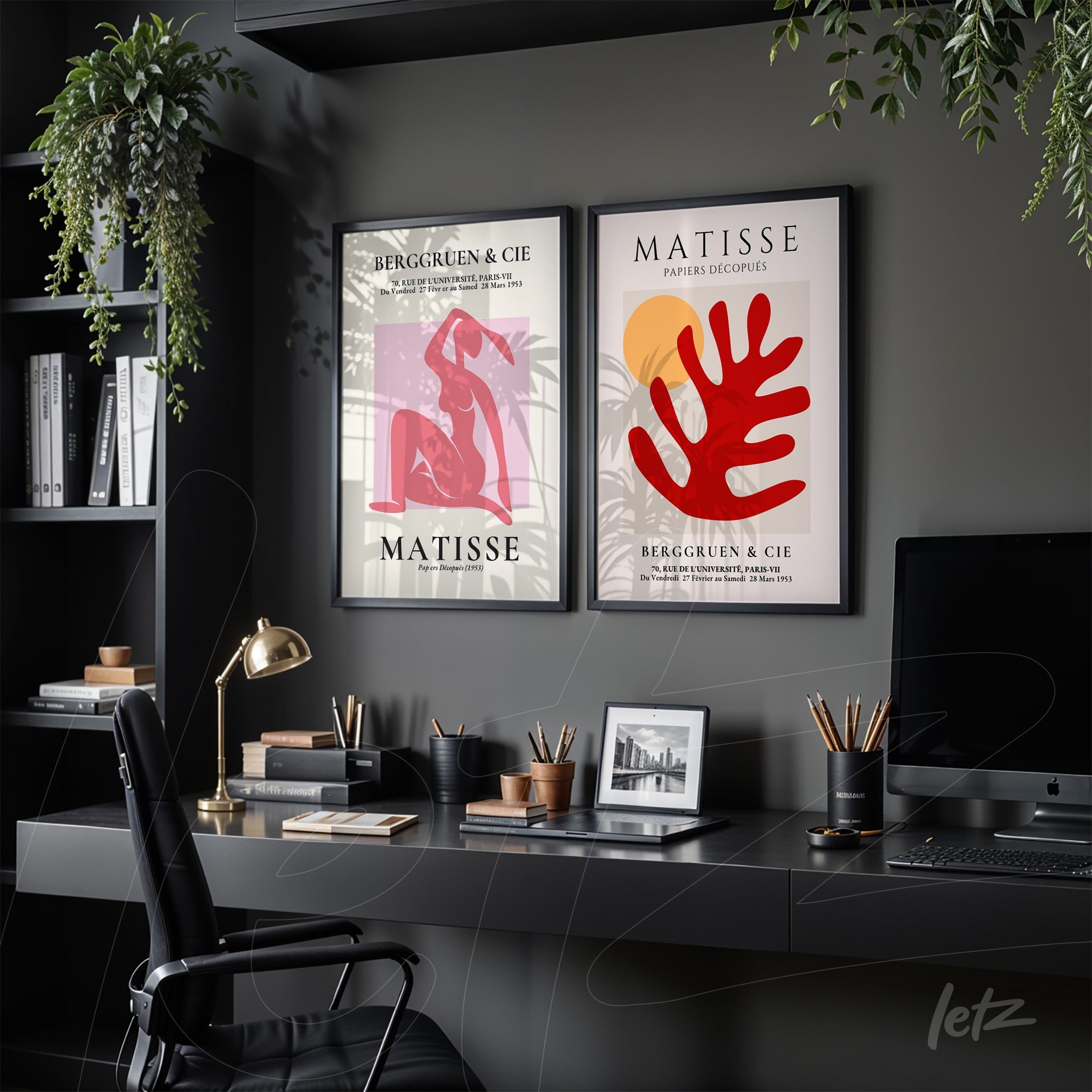 composition of two framed wall artworks in black frames, one featuring a stylized female figure on a pink background and the other displaying red foliage and orange sun on a light background, displayed in a modern setting with shelves and plants