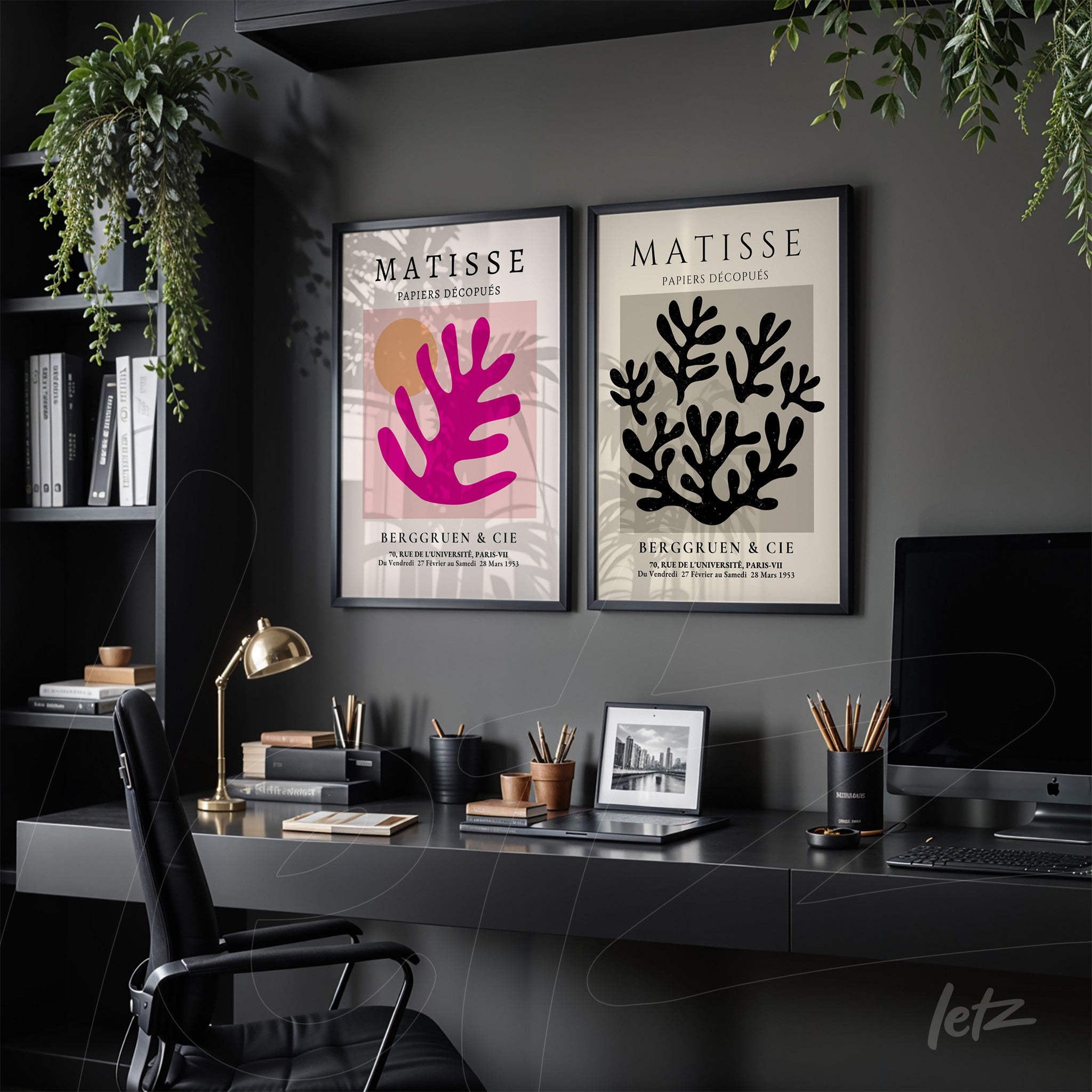 composition of framed wall art in black frame featuring abstract shapes in vibrant colors on dark wall
