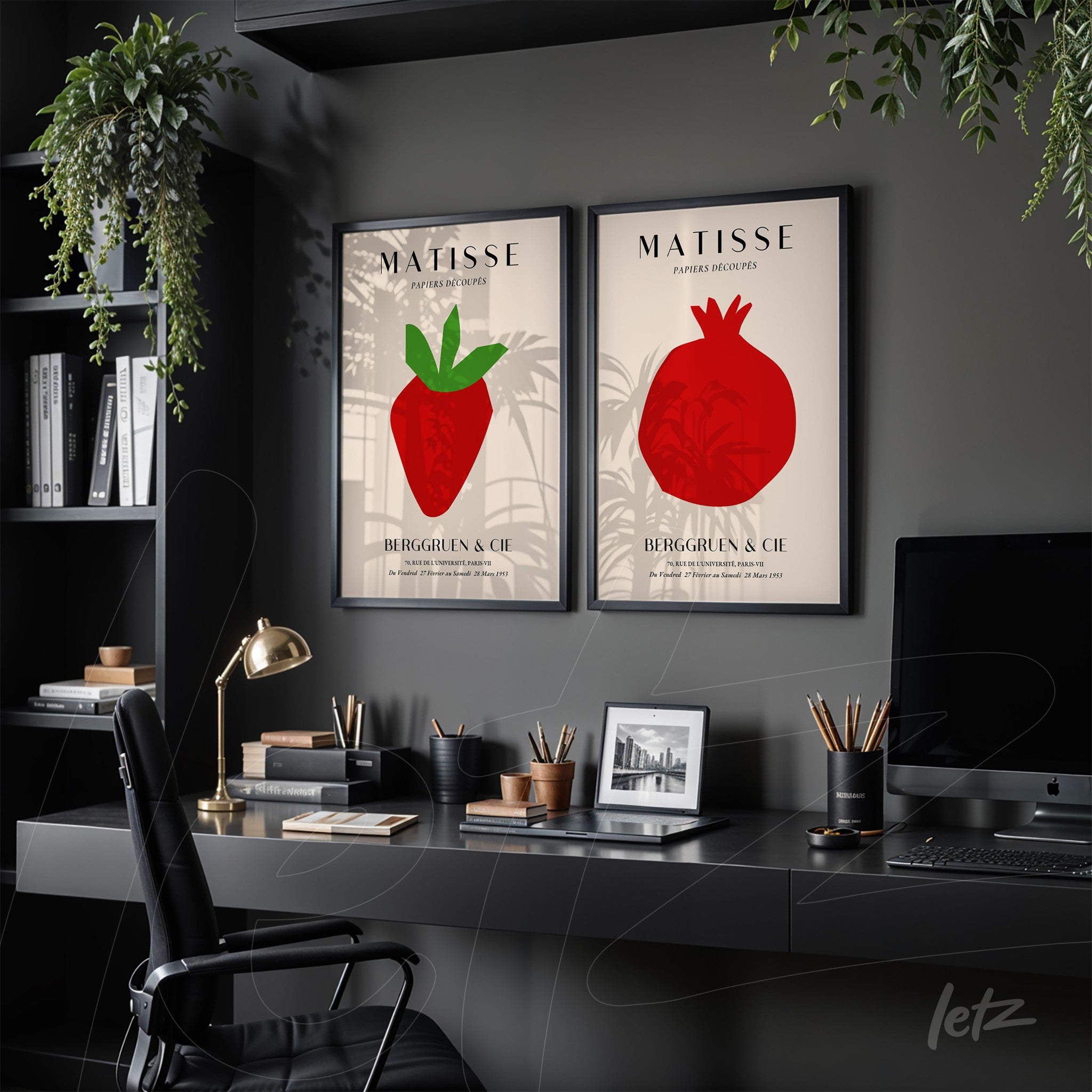 composition of decorative wall art featuring red fruit illustrations with black frames displayed in a stylish office setting with a wooden desk