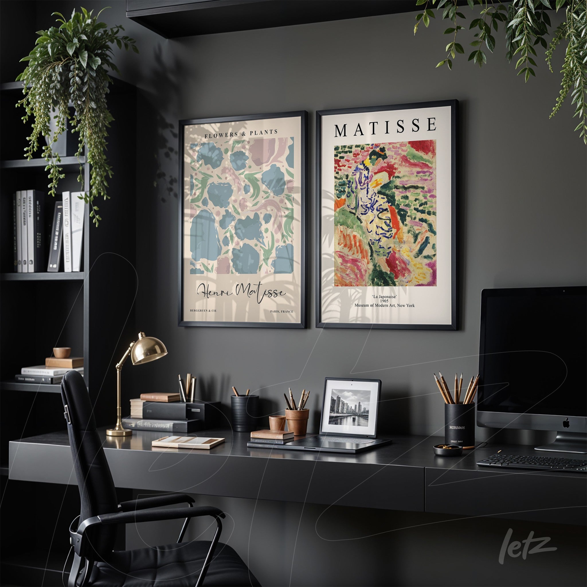 framed modern art composition featuring one artwork of green leaves and another of colorful figures, displayed in a stylish office setting