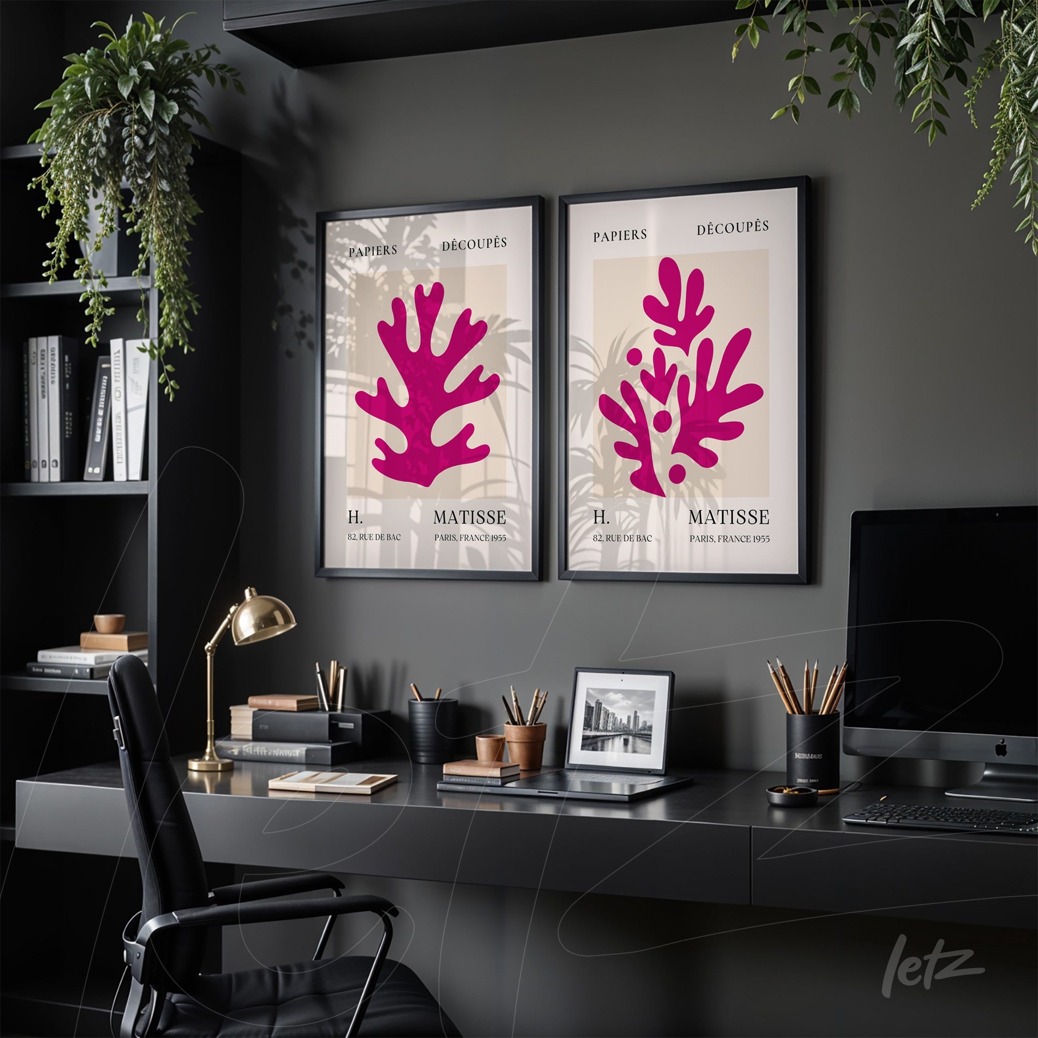framed wall art composition featuring abstract coral designs in shades of pink on cream background displayed on a modern office desk