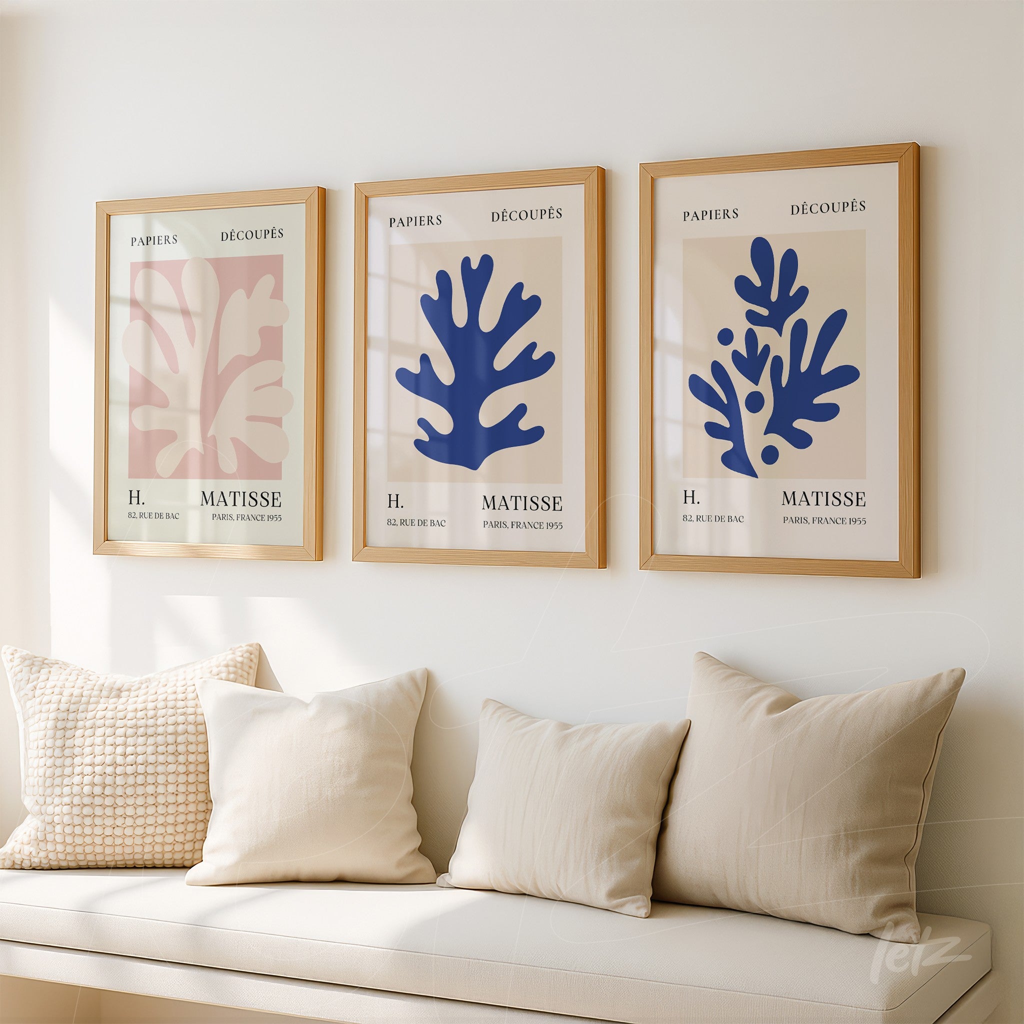 series of three decorative frames featuring abstract leaf shapes in blue and pink tones on light background