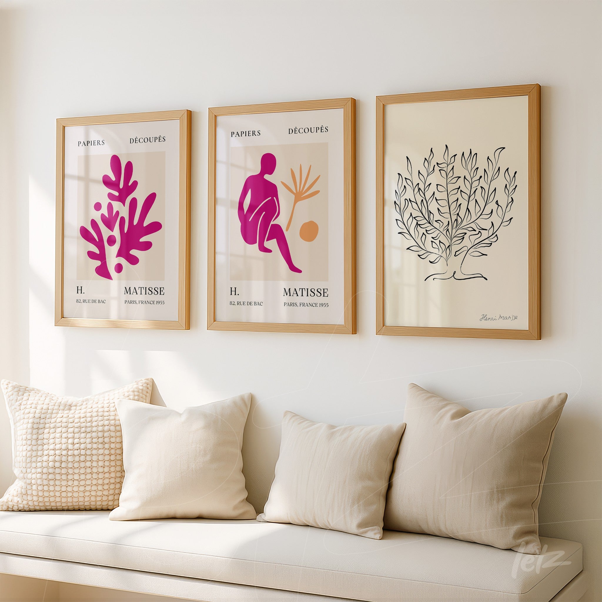 composition of framed wall art in light wood featuring modern illustrations of plants and a human figure