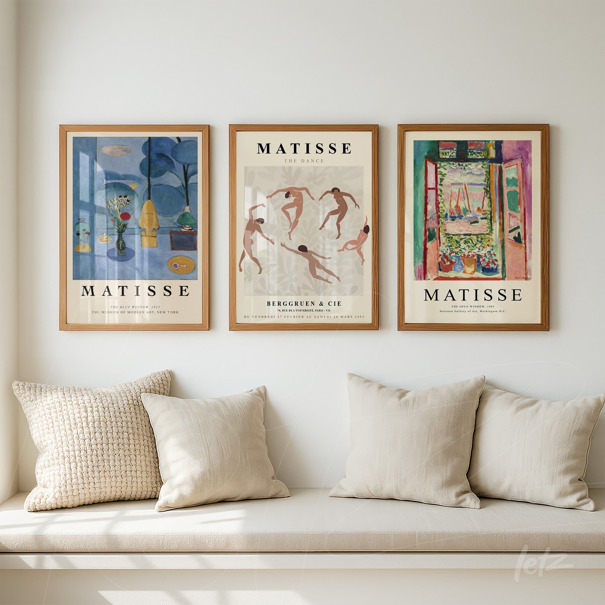 composition of three decorative wall art pieces in light wooden frames featuring reproductions of Matisse's artworks displayed on a white wall