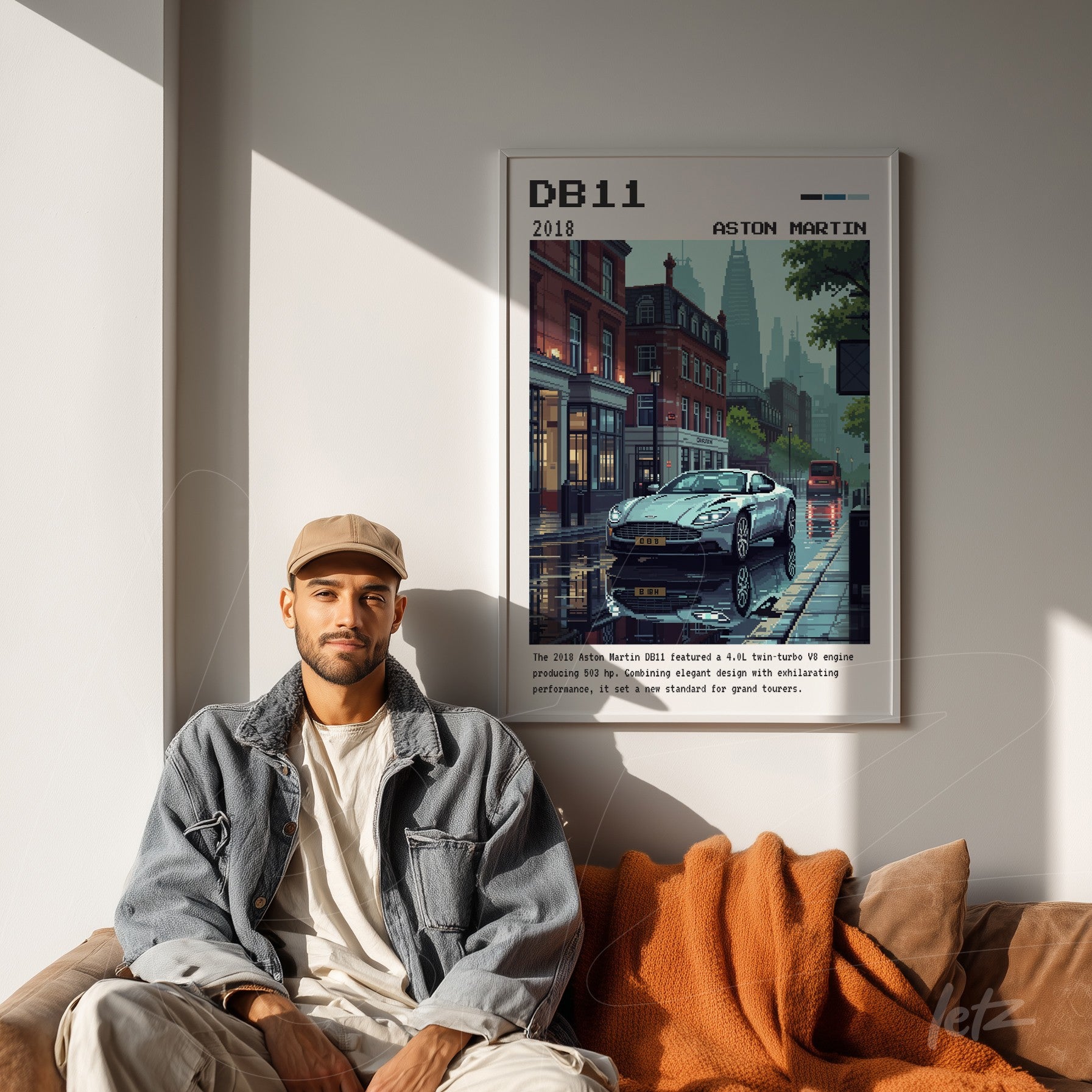 framed graphic art of the aston martin db11 car with an urban background in a white frame displayed in a modern living room
