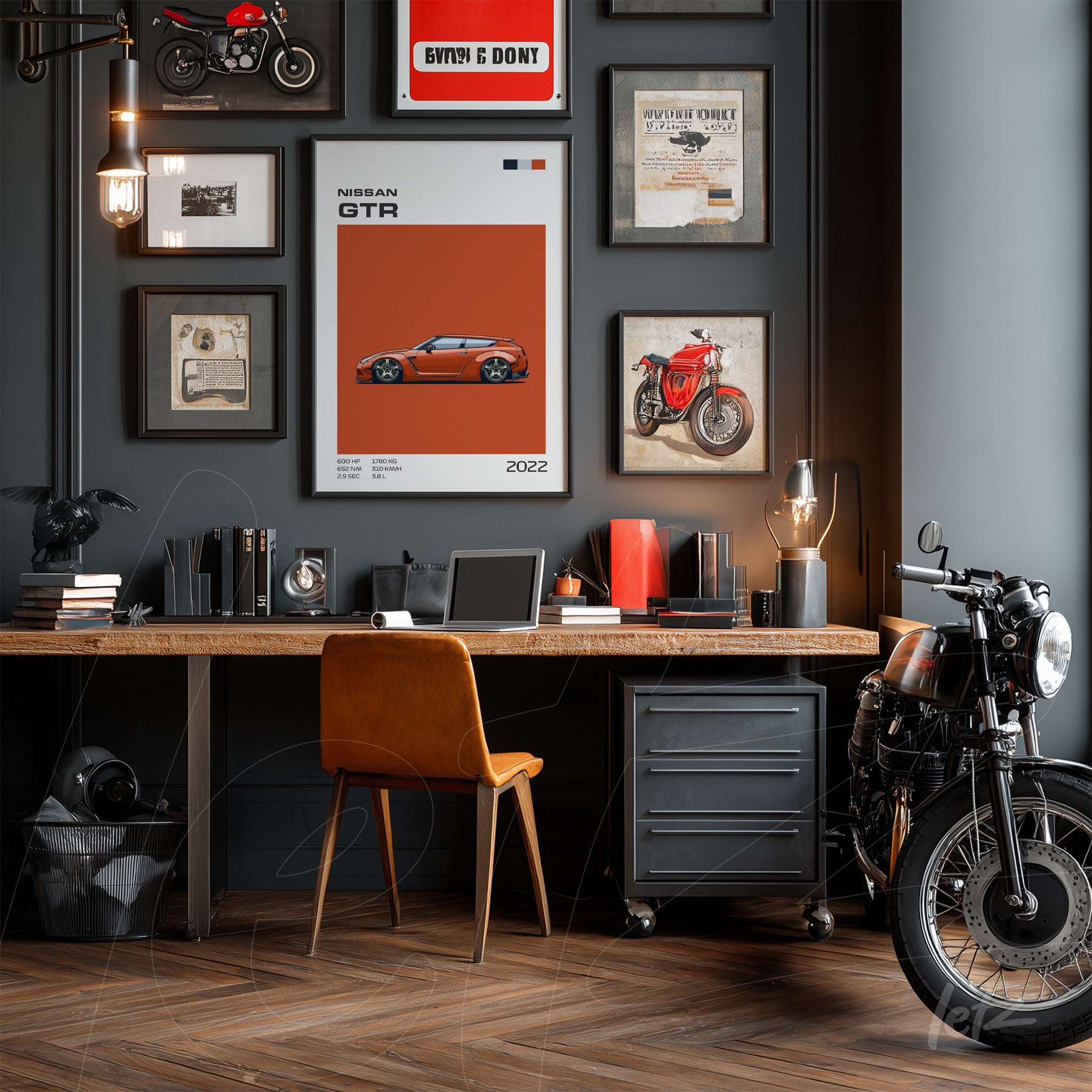 workspace featuring a variety of framed car and motorcycle art, with a central print of the 2022 Nissan GTR